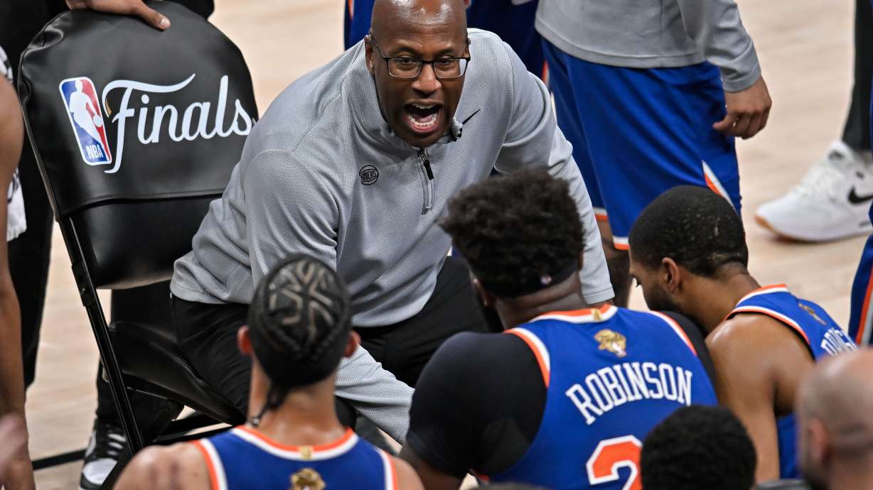 New York Knicks head coach Mike Brown talks with his team during a time out during the first half of Game 5 of the NBA Finals basketball series against the San Antonio Spurs, Saturday, June 13, 2026, in San Antonio.