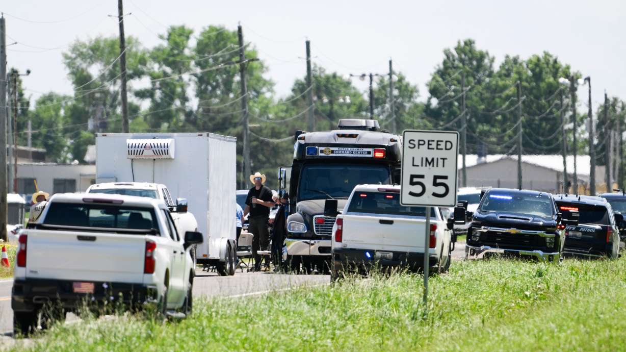 Emergency vehicles parked outside the Butler Memorial Airport after a plane crash in Butler, Mo., Sunday, June 14, 2026.