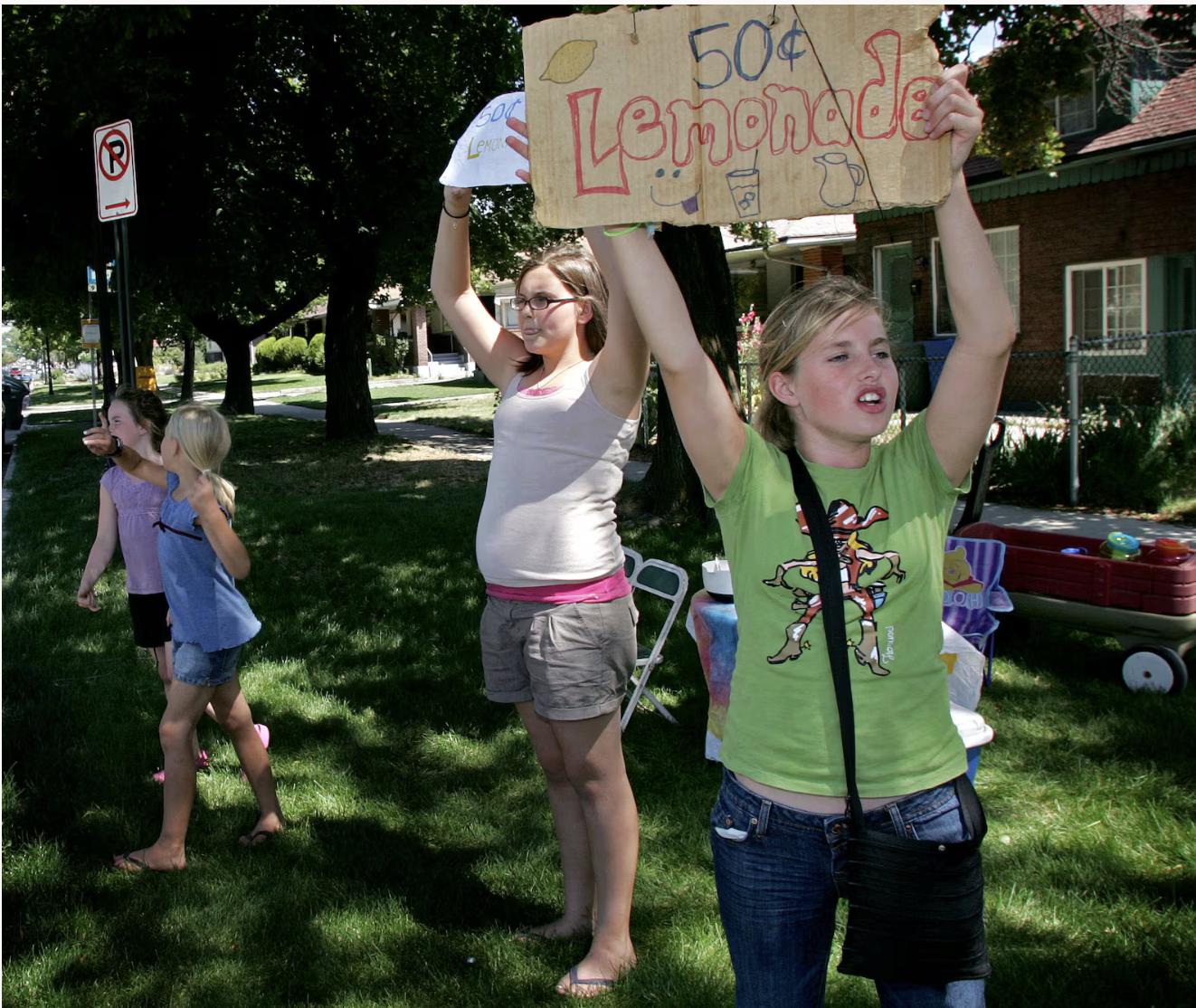 Ice cold lemonade! Fifty cent lemonade! " come the cries from the corner of 300 E and 900 S in Salt Lake City on Saturday afternoon as Olivia Loveland, 11, Kaya Poore, 13, Phoenix Poore, 8, and Sophia Loveland, 9, right to left, sell lemonade to passersby on the hot summer day.
