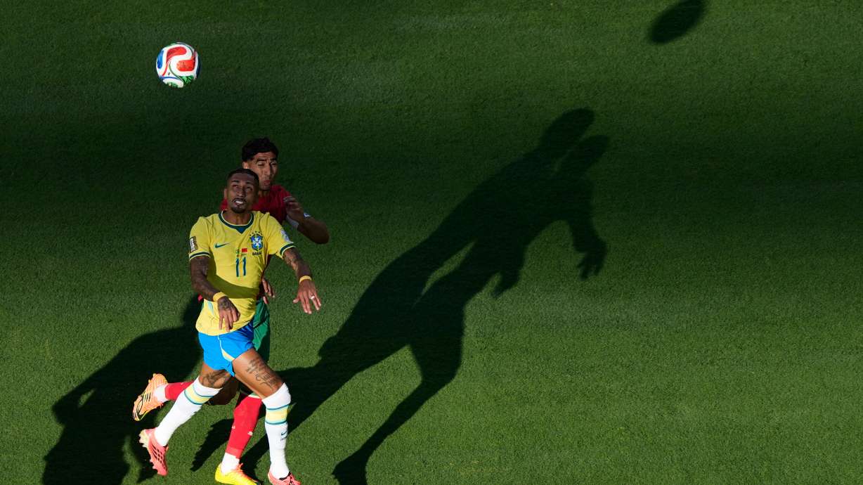 Brazil's Raphinha (11) and Morocco's Achraf Hakimi go up for a head ball during the World Cup Group C soccer match in East Rutherford, N.J., near New York, Saturday, June 13, 2026.