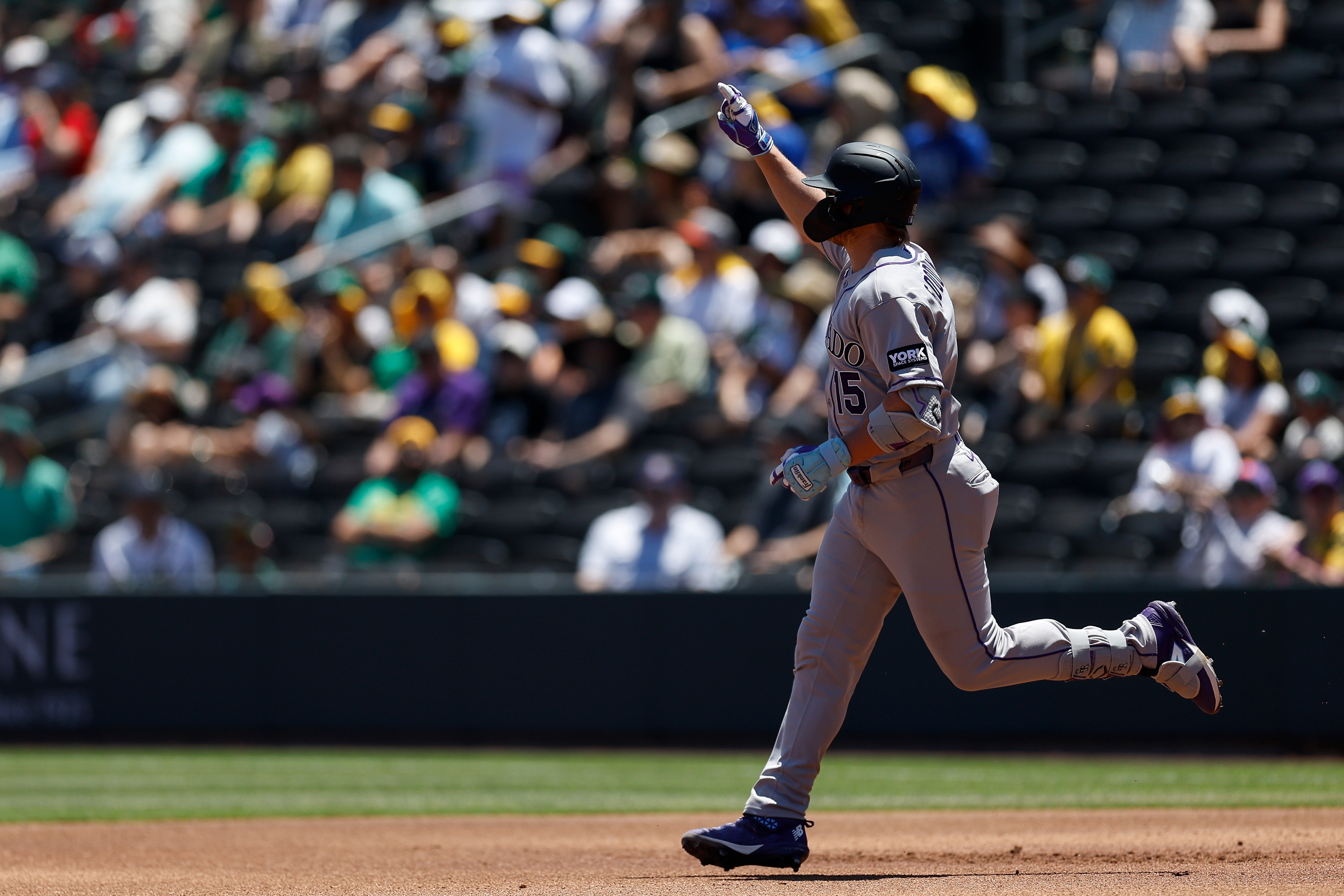 Colorado Rockies' Hunter Goodman rounds the bases after hitting a two-run home run during the first inning of a baseball game against the Athletics, Sunday, June 14, 2026, in Las Vegas.