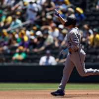 Rockies set club record for runs with 23-9 victory over A's in Las Vegas heat