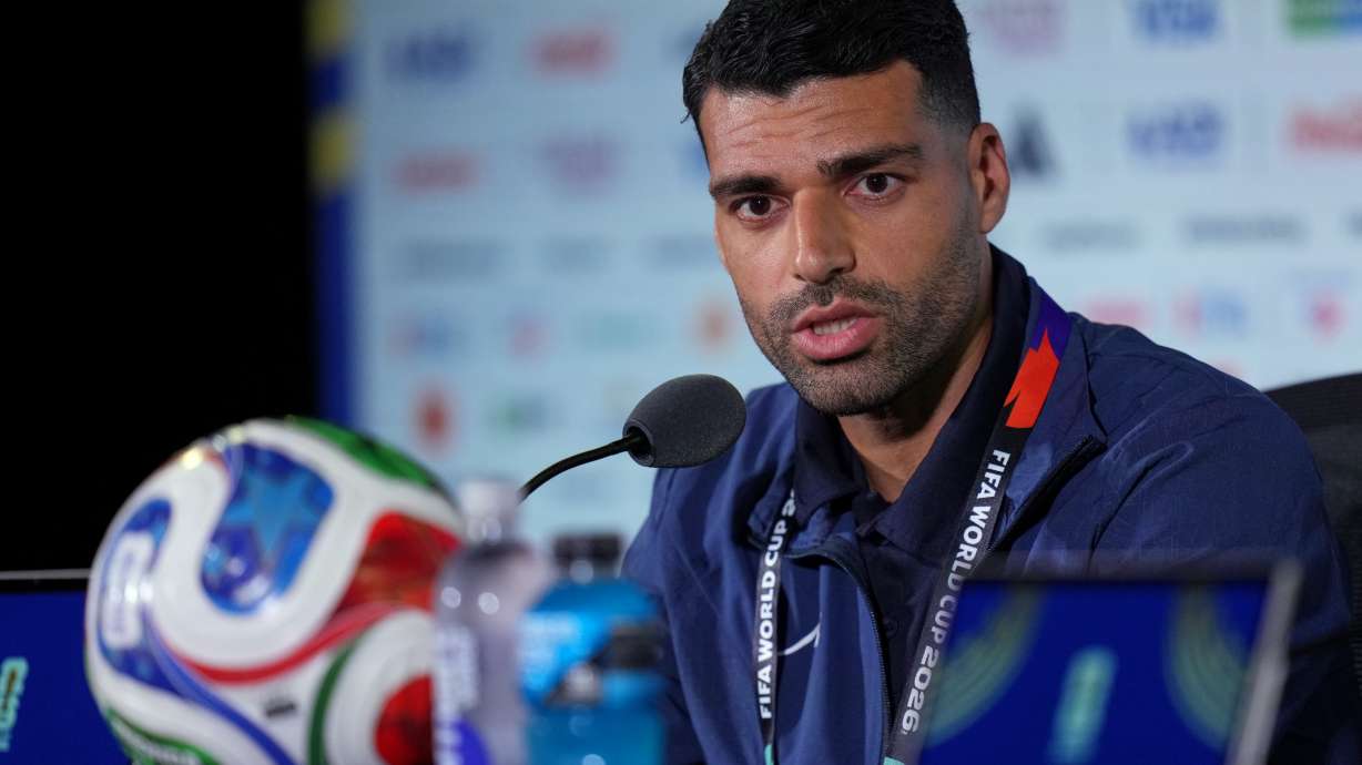 Iran's Mehdi Taremi speaks during a press conference ahead of his FIFA World Cup match against New Zealand in Inglewood, Calif., near Los Angeles, Sunday, June 14, 2026.