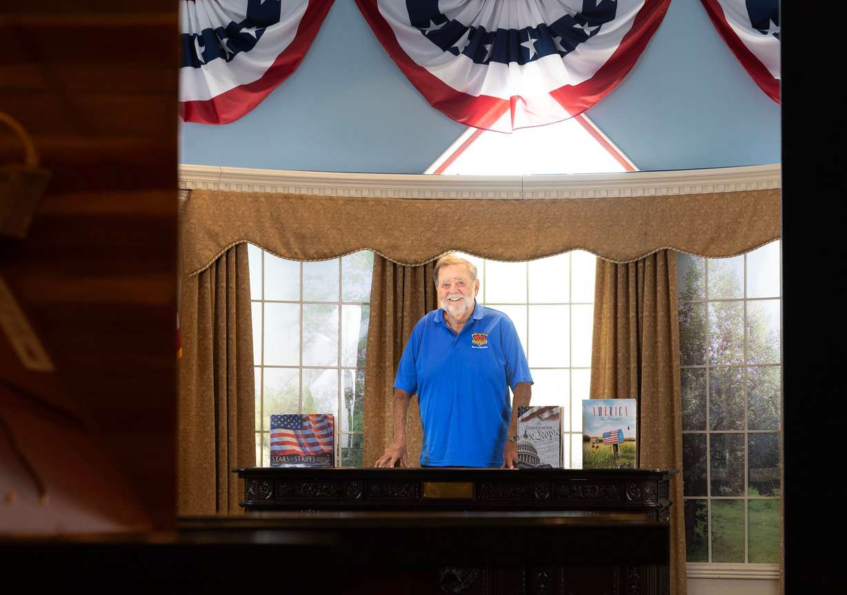 John Gullo, author of “Extraordinary Adventures of An Ordinary Man,” stands in a replica of the Oval Office in the Treehouse Children's Museum in Ogden on Thursday, May 21, 2026.