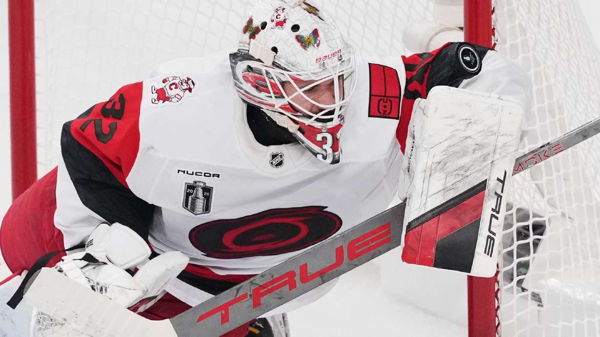 Carolina Hurricanes goaltender Brandon Bussi (32) stops a shot on goal during the first period in Game 6 of the NHL hockey Stanley Cup Final series against the Vegas Golden Knights, Sunday, June 14, 2026, in Las Vegas.