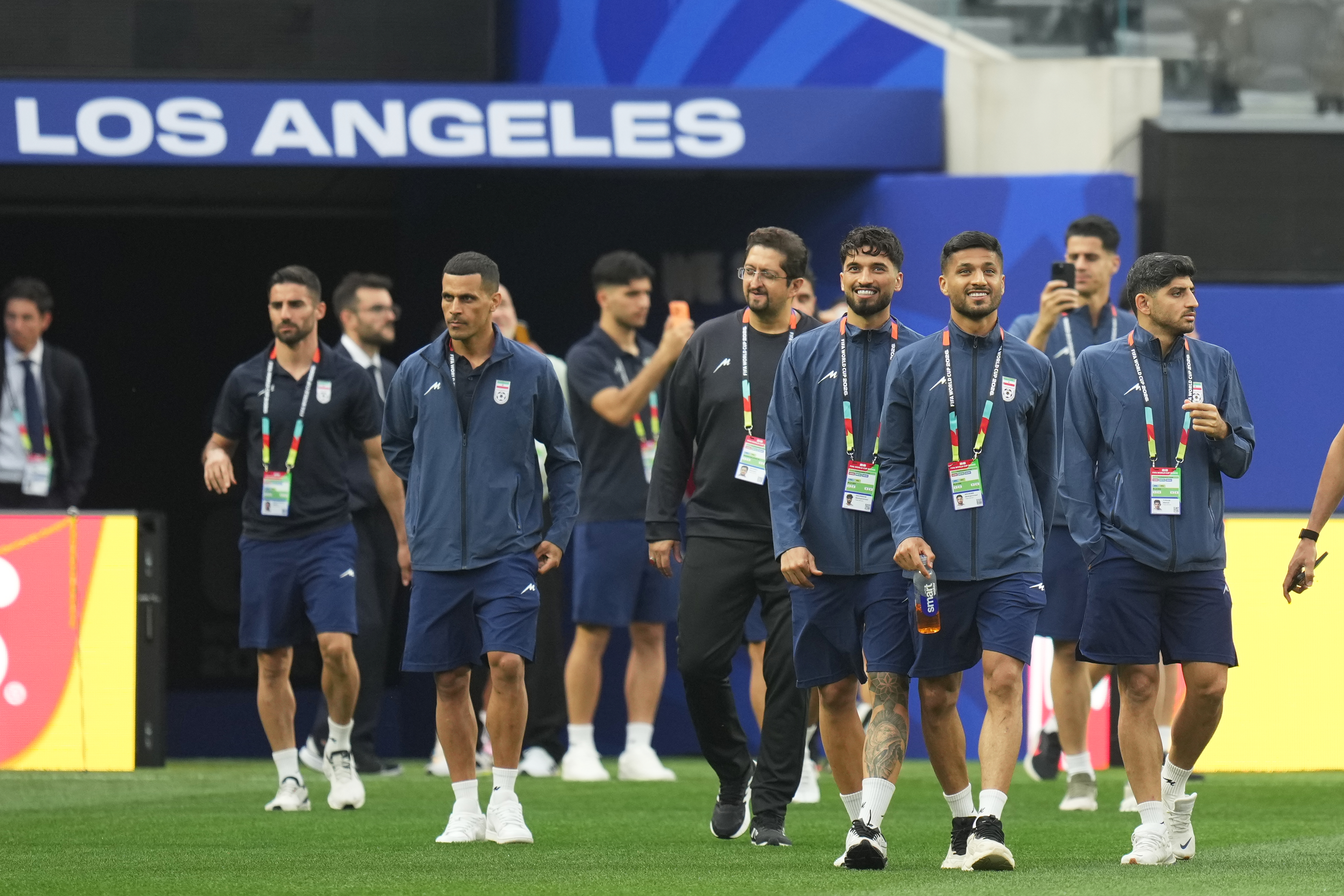 Iran players walk onto the pitch at the stadium one day before their FIFA World Cup match against New Zealand in Inglewood, Calif., near Los Angeles, Sunday, June 14, 2026.