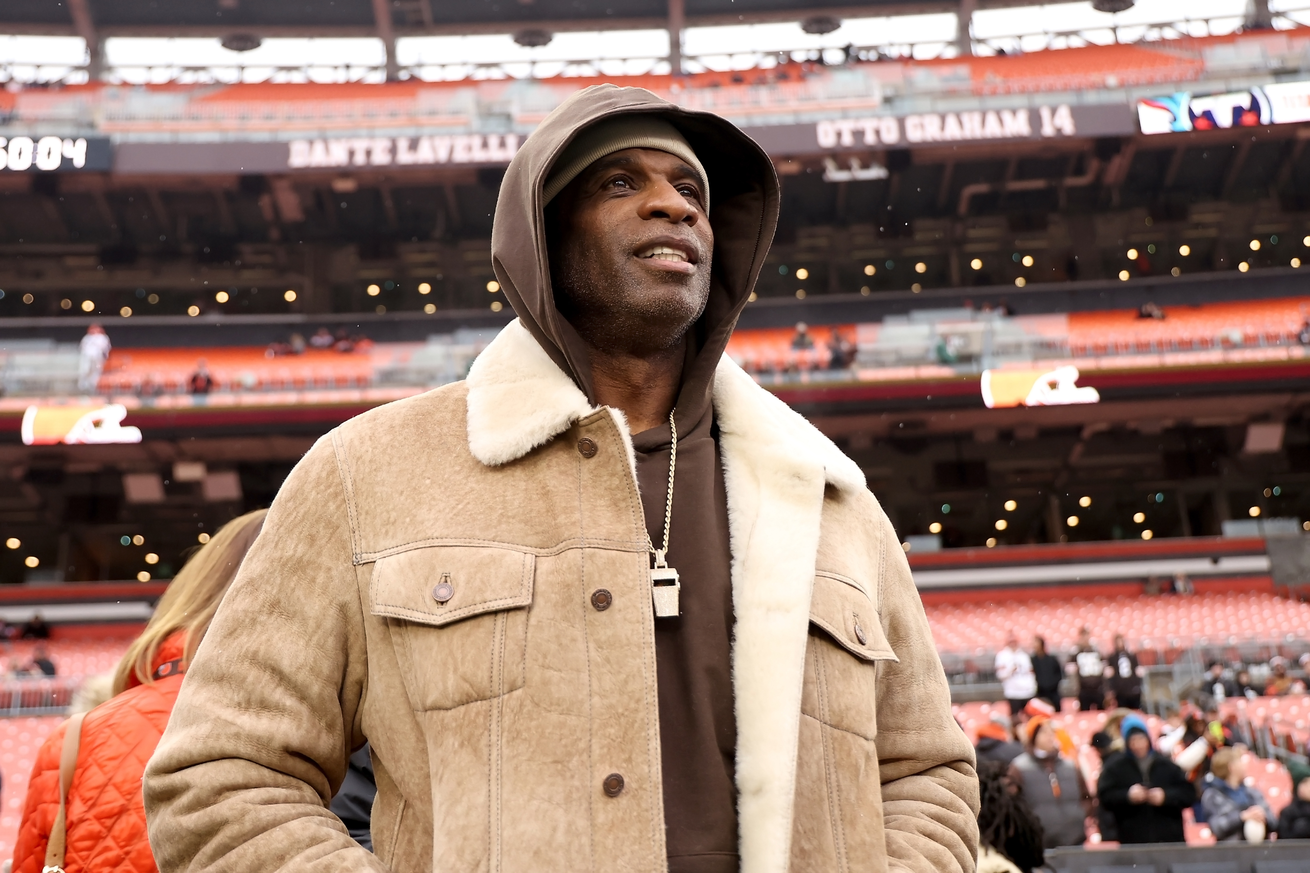 FILE - University of Colorado head coach Deion Sanders stands on the sidelines prior to the start of an NFL football game between the Cleveland Browns and the Tennessee Titans, Sunday, Dec. 7 2025, in Cleveland.