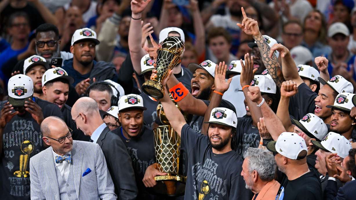 New York Knicks guard Jalen Brunson holds the MVP trophy after the Knicks defeated the San Antonio Spurs in Game 5 of the NBA Finals basketball series, Saturday, June 13, 2026, in San Antonio.