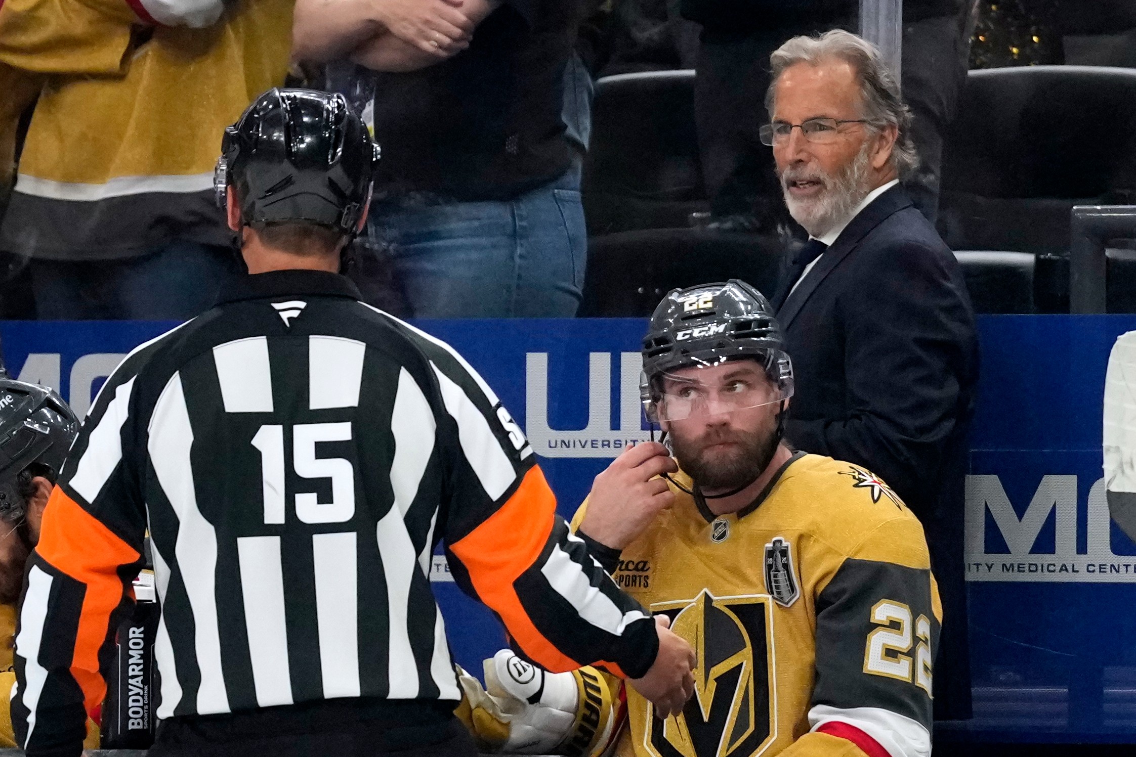 Vegas Golden Knights head coach John Tortorella, right, talks to a referee during the third period in Game 4 of the NHL hockey Stanley Cup Final series against the Carolina Hurricanes, Tuesday, June 9, 2026, in Las Vegas.