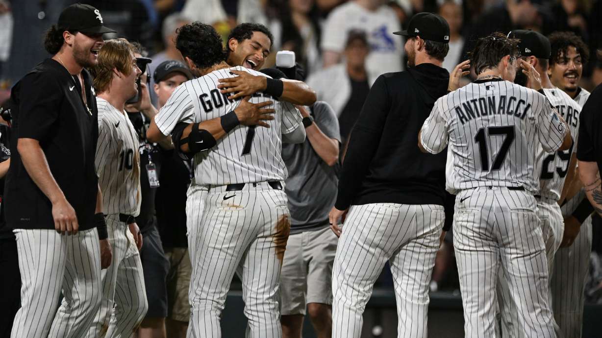 Chicago White Sox's Braden Montgomery, back, hugs teammate Jacob Gonzalez (7) after hitting a walk-off two-run home run in the 10th inning of a baseball game to defeat the Atlanta Braves in Chicago, Tuesday, June 9, 2026.