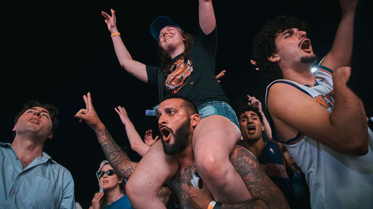 New York Knicks fans celebrate as they watch Game 5 of the NBA Finals basketball series against the San Antonio Spurs, Saturday, June 13, 2026, in New York.