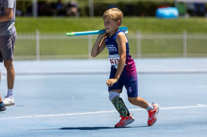 Zach Adler, 10, throws the javelin at a recent track meet. Zach was born without a fibula in his right leg, requiring amputation below his knee.