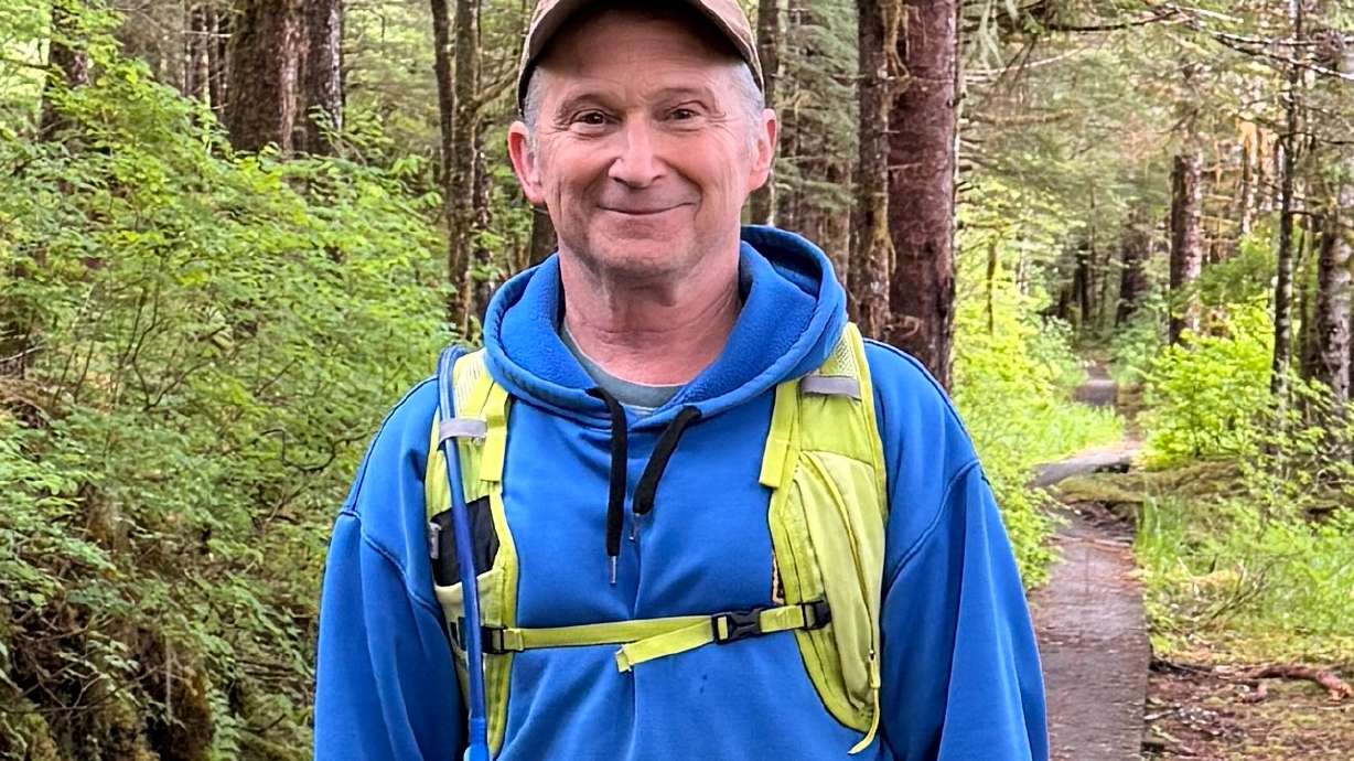 In this image provided by Karen Dillman, Alaska Senate candidate Dan Sullivan, one of the challengers to the incumbent senator, also named Dan Sullivan, poses for a photo on a hike, June 7, on Kupreanof Island, near Petersburg, Alaska.