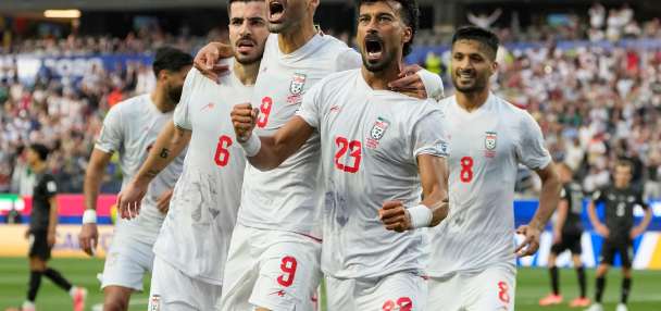 Iran opens its politically charged World Cup by playing to a 2-2 draw with New Zealand