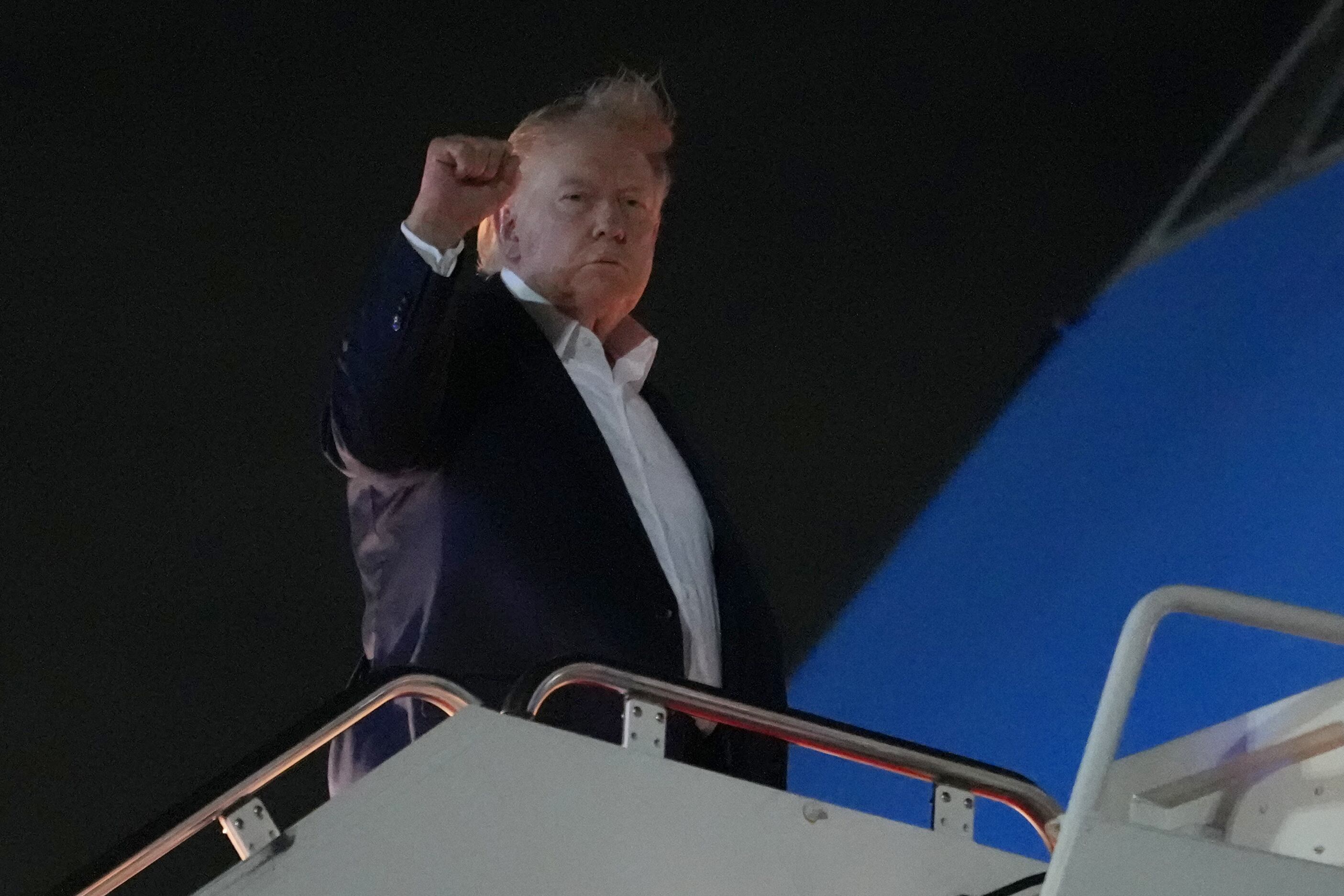 President Donald Trump boards Air Force One, Monday, at Joint Base Andrews, Md. Trump said he won't reauthorize a key government surveillance program unless Republicans attach an election reform bill to the final package.
