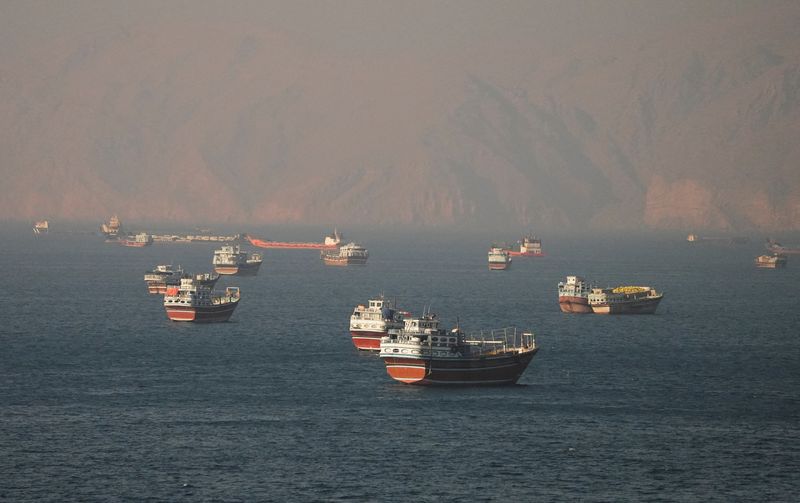 Vessels at the Strait of Hormuz, as seen from Musandam, Oman, Monday. The strait is expected to open on Friday as part of an interim deal to end the war in Iran.