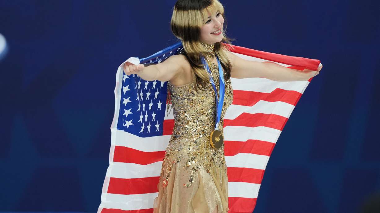 FILE - Gold medalist Alysa Liu of the United States celebrates her medal after competing in the women's free skate program in figure skating at the 2026 Winter Olympics, in Milan, Italy, Thursday, Feb. 19, 2026.
