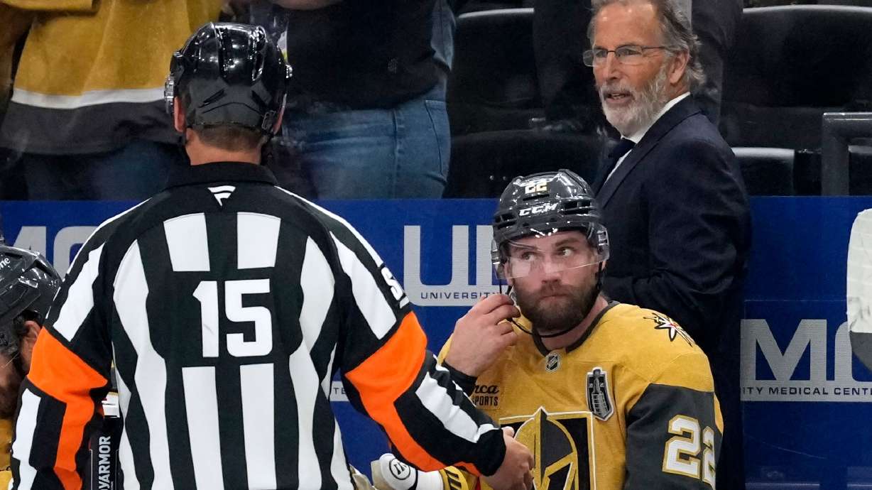Vegas Golden Knights head coach John Tortorella, right, talks to a referee during the third period in Game 4 of the NHL hockey Stanley Cup Final series against the Carolina Hurricanes, Tuesday, June 9, 2026, in Las Vegas.