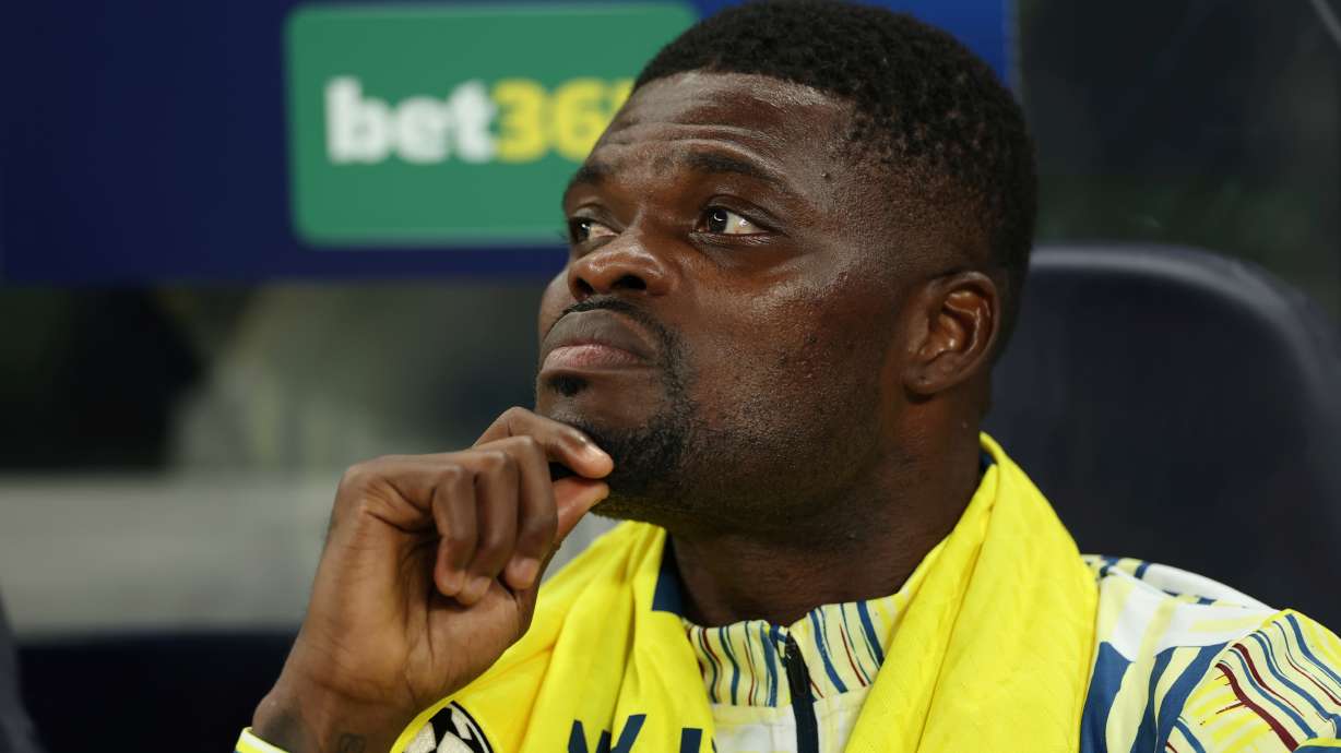 FILE - Villarreal's Thomas Partey sits on the bench during the Champions League soccer match between Tottenham and Villarreal in London, Tuesday, Sept. 16, 2025.