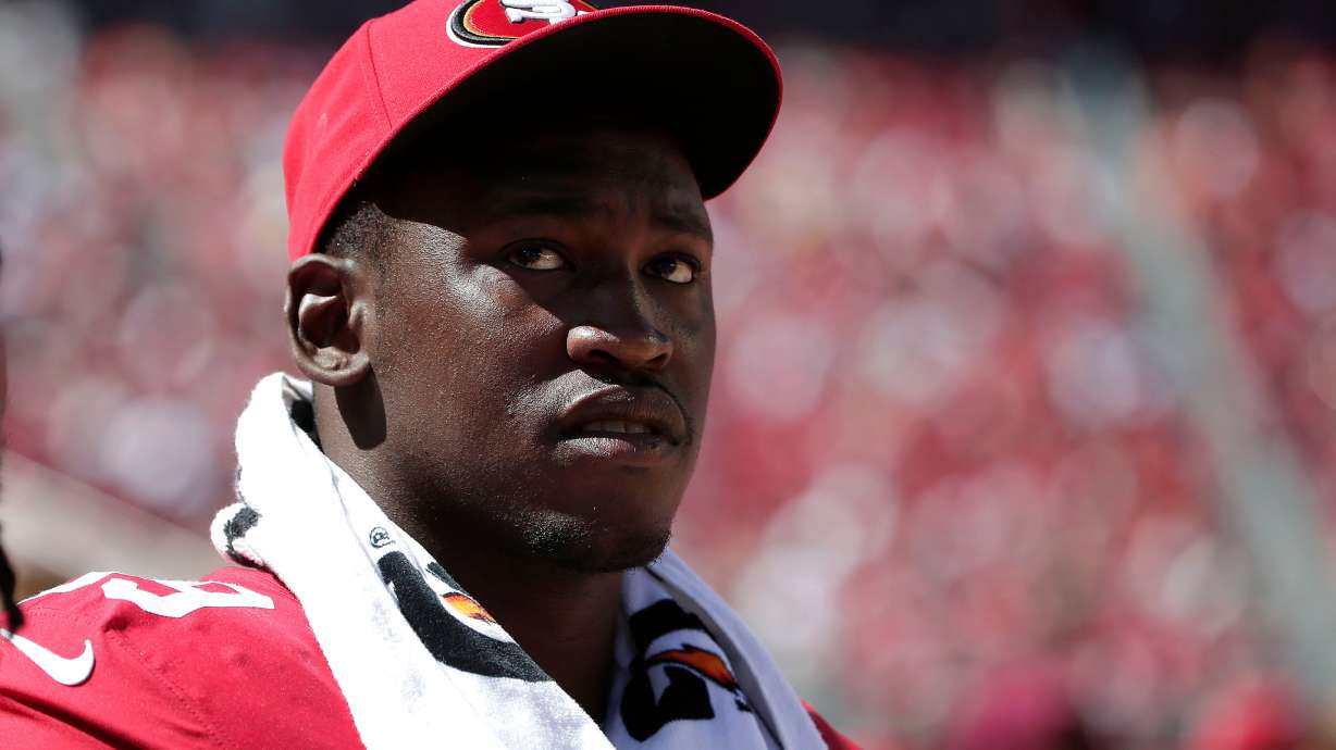 FILE - San Francisco 49ers linebacker Aldon Smith (99) watches from the sideline during the second half of an NFL preseason football game against the Denver Broncos Aug. 17, 2014, in Santa Clara, Calif.