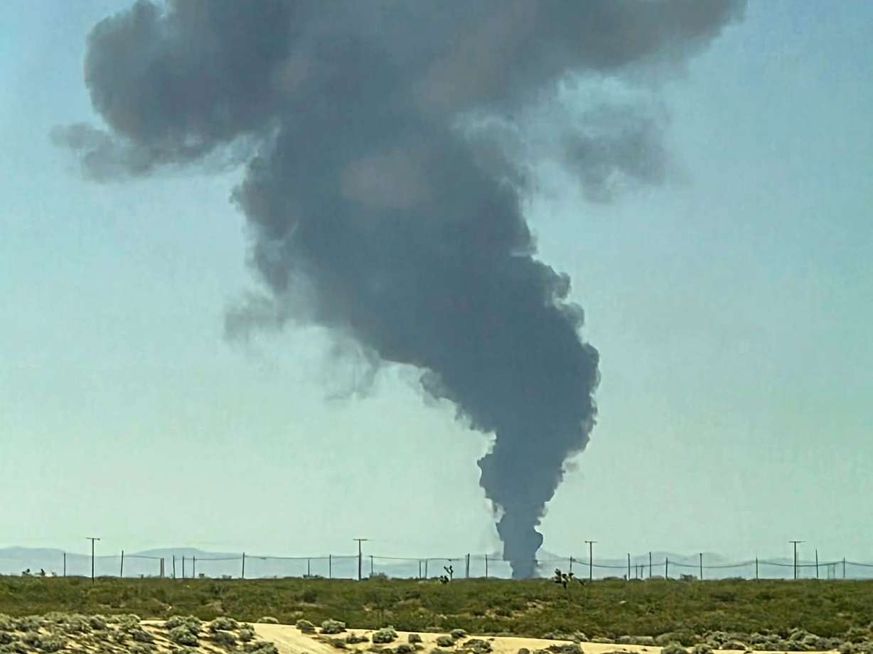 Smoke plumes rise from a B-52 bomber that crashed shortly after takeoff at a U.S. Air Force base in Southern California, Monday.