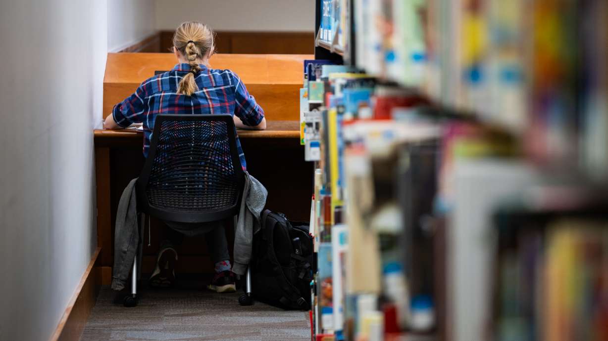 A University of Utah student works at the J. Willard Marriott Library in Salt Lake City on April 1. A legislative audit released Tuesday found Utah's higher education landscape has experienced a surge in enrollment fraud.