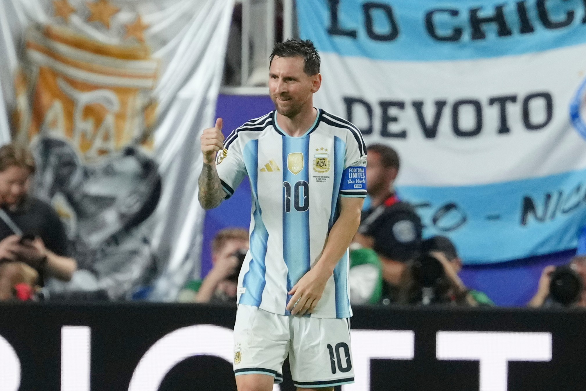 Messi has his first World Cup hat trick as defending champion Argentina beats Algeria 3-0 in opener