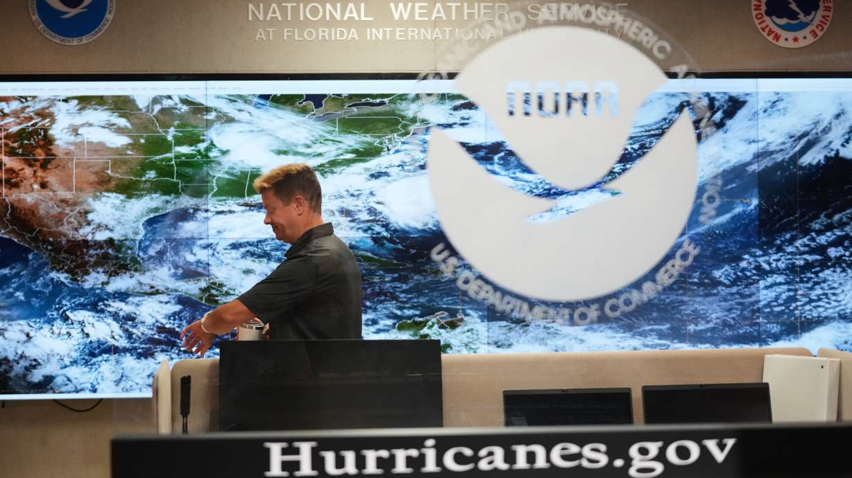 Robbie Berg, Warning Coordinator Meteorologist, works at the National Hurricane Center on the first day of hurricane season, June 1, in Miami. The NHC is issuing advisories on Potential Tropical Cyclone One-C, that could pose a threat to Hawaii, while a new tropical storm formed in the Atlantic Ocean.
