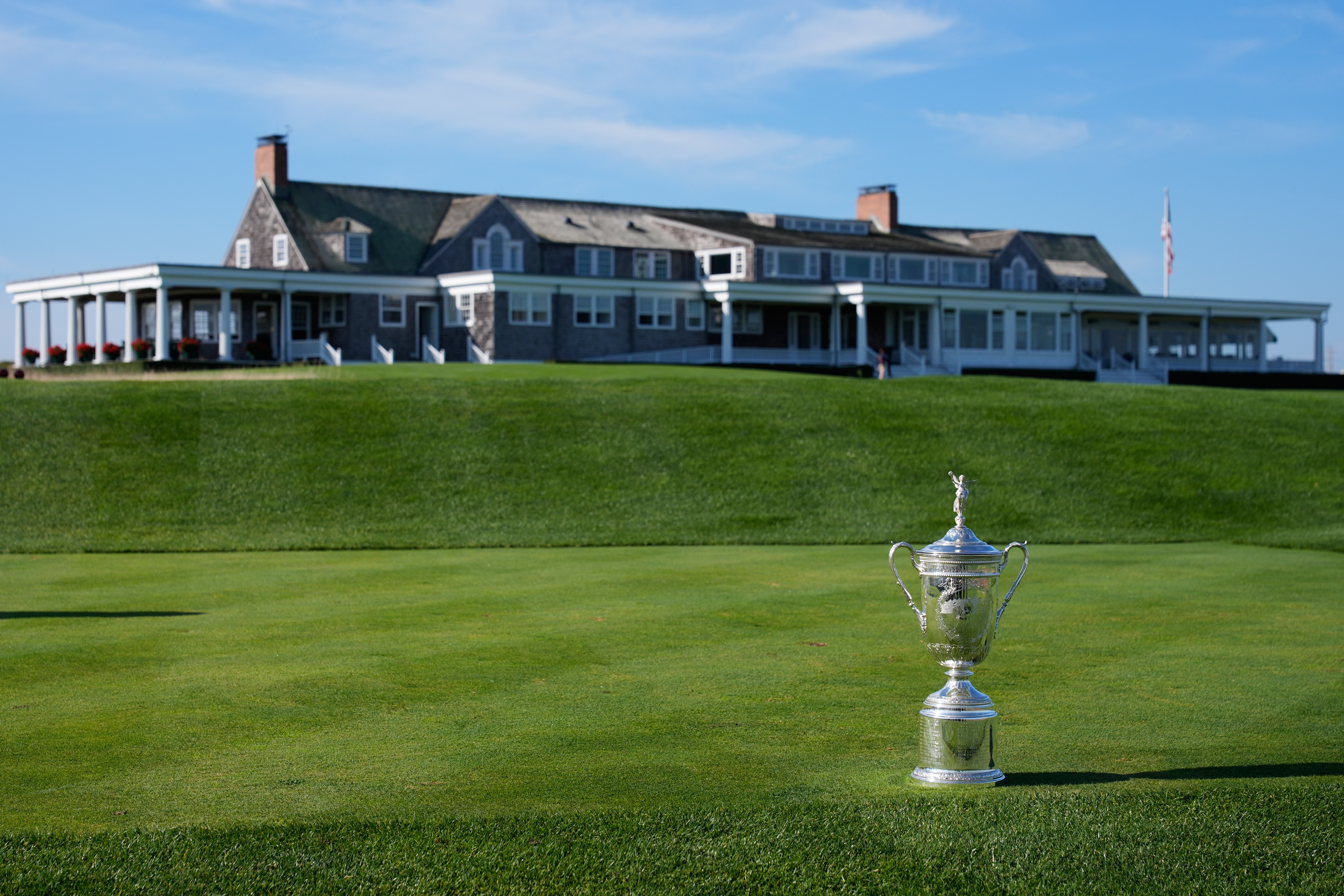 FILE - The U.S. Open Golf Championship trophy is displayed in front of the clubhouse at Shinnecock Hills Golf Club in Southampton, N.Y., Sept. 15, 2025.