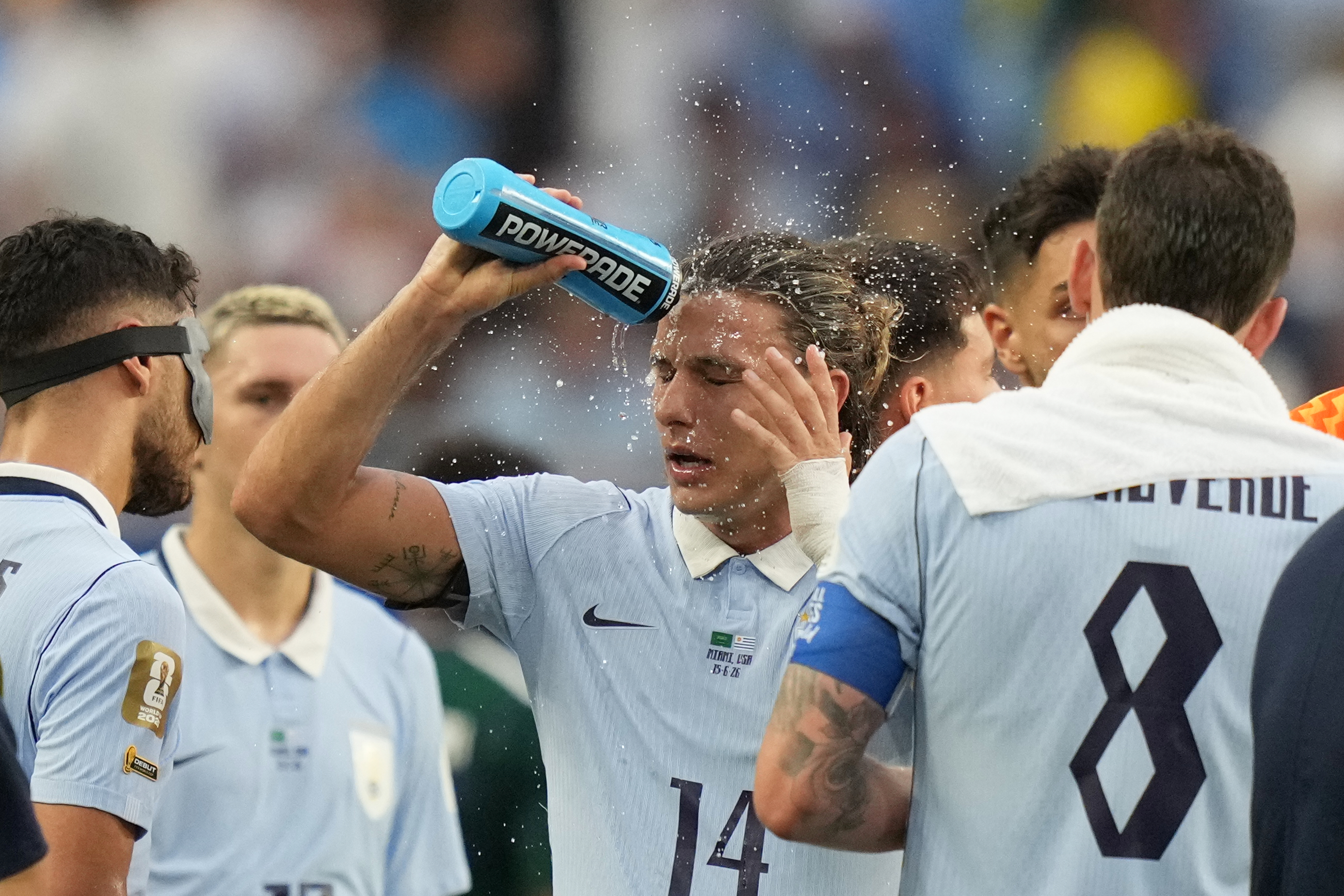 Uruguay's Agustin Canobbio cools off during a hydration break in a World Cup Group H soccer match against Saudi Arabia in Miami Gardens, Fla., Monday, June 15, 2026.