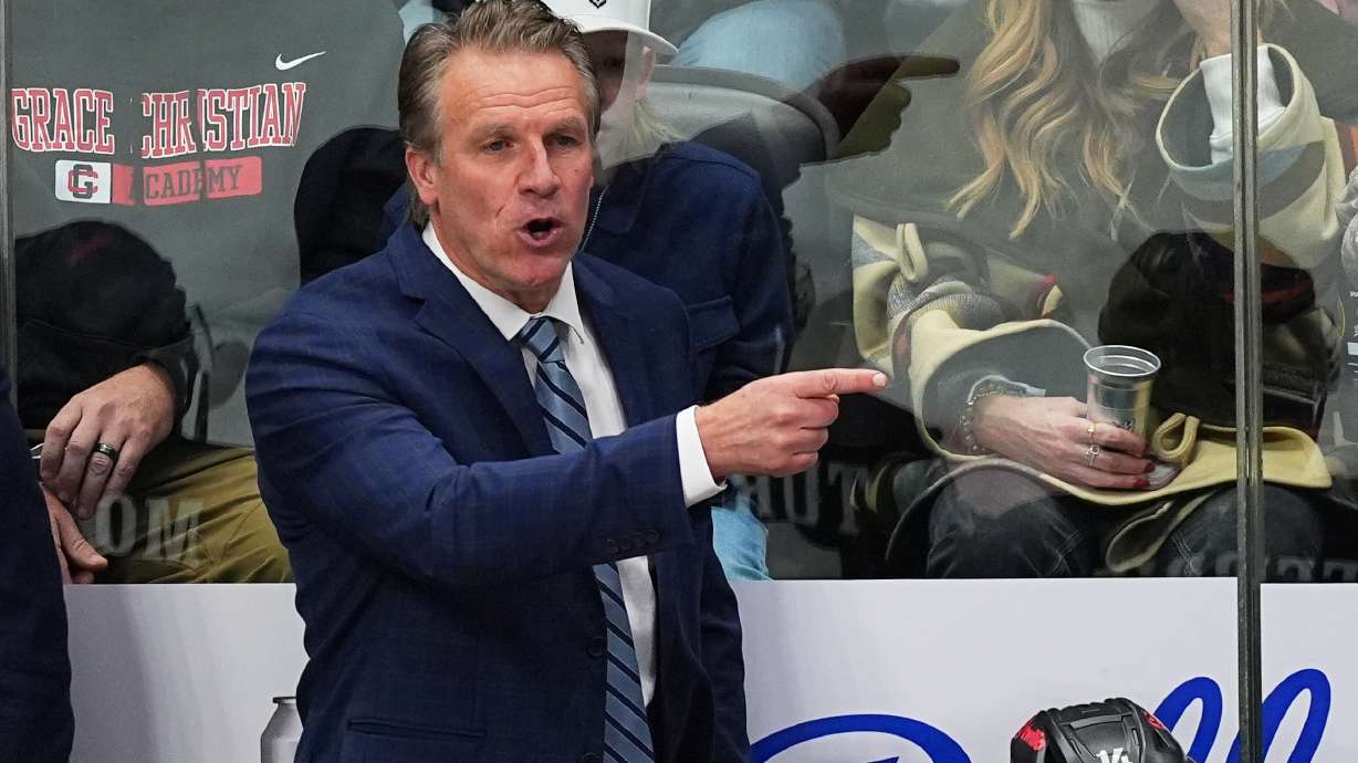 FILE - Los Angeles Kings head coach Jim Hiller directs his players from the team box in the third period of an NHL hockey game against the Colorado Avalanche Dec. 29, 2025, in Denver.