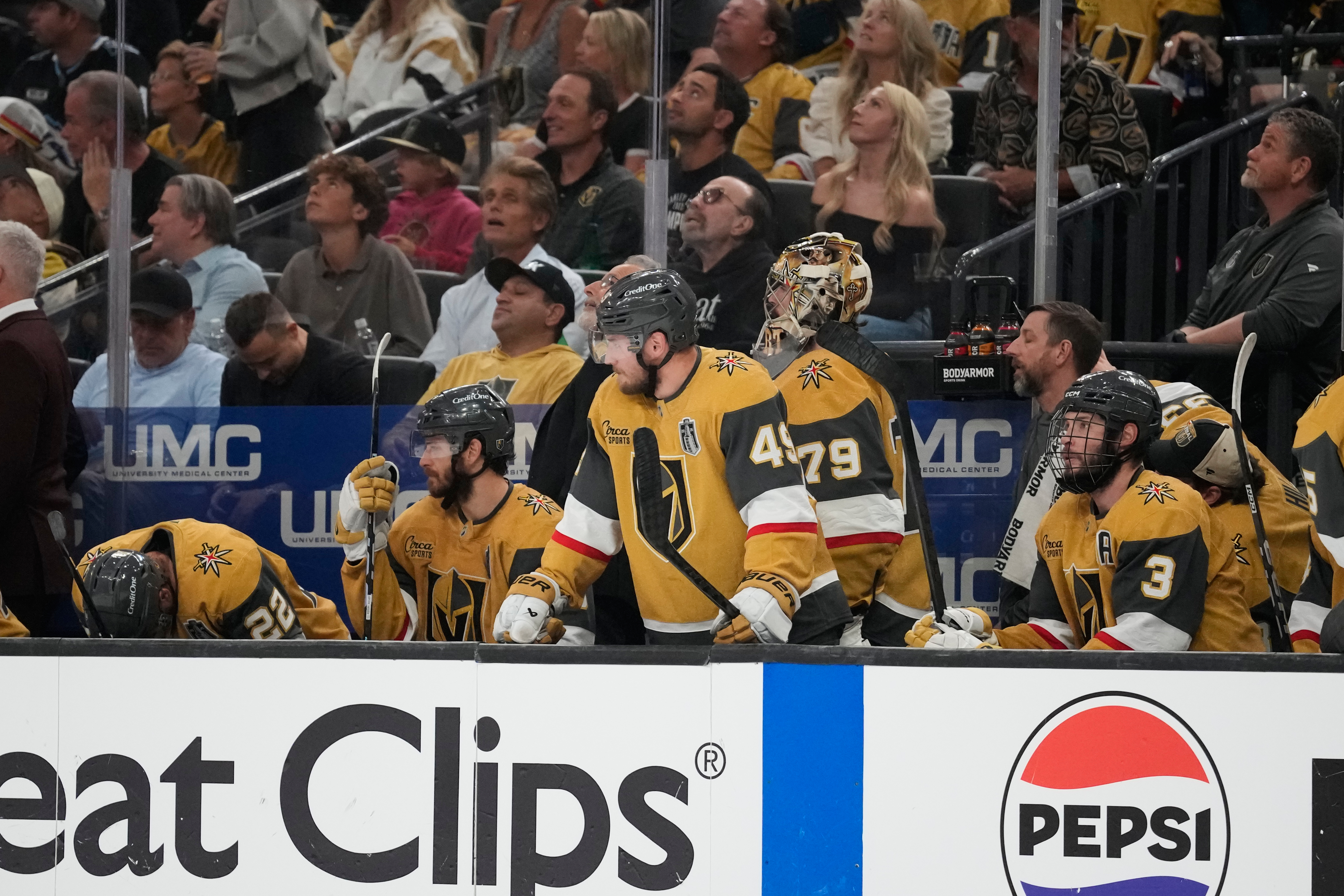 Vegas Golden Knights players watch from the bench during the third period in Game 6 of the NHL hockey Stanley Cup Final series against the Carolina Hurricanes, Sunday, June 14, 2026, in Las Vegas. 