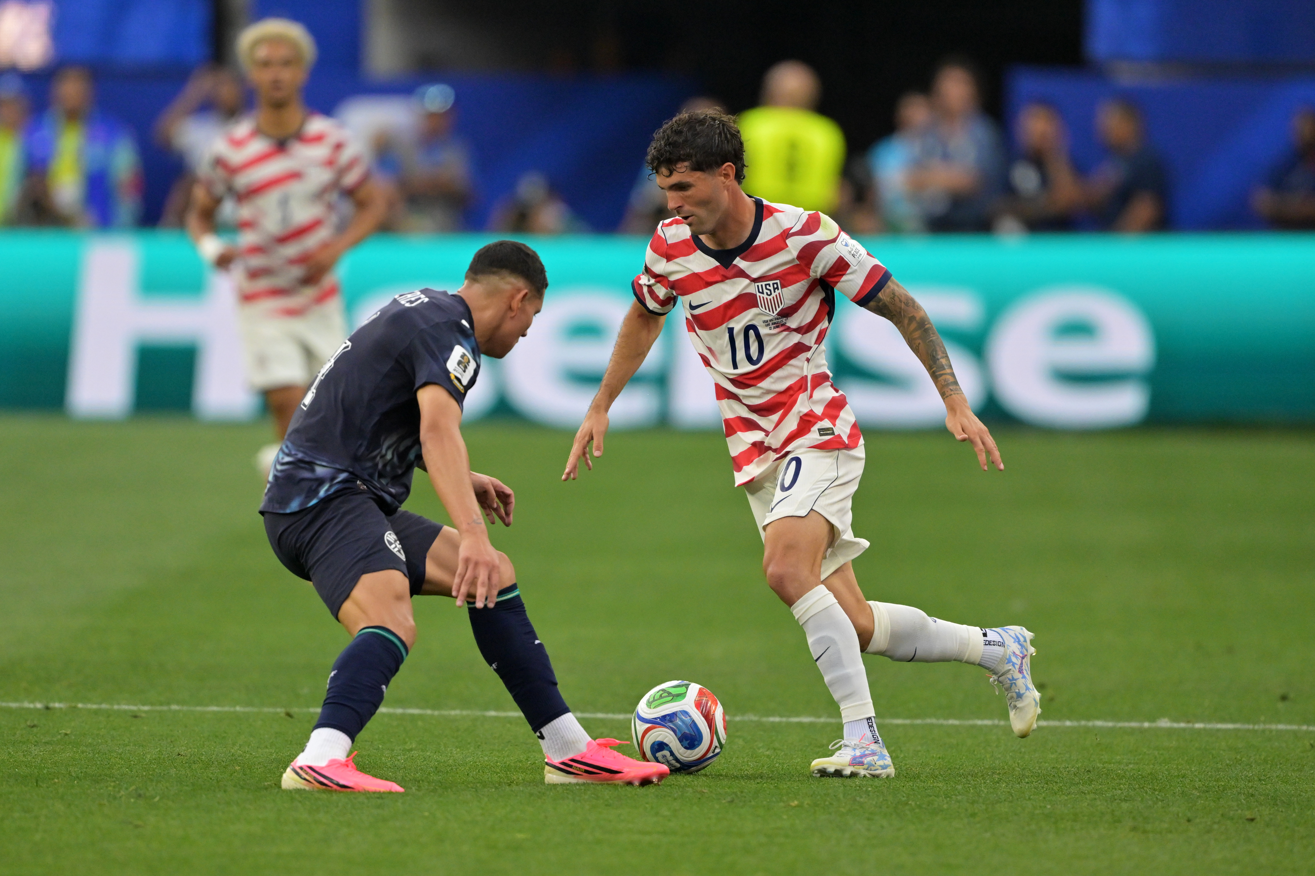 United States' Christian Pulisic (10) dribbles past Paraguay's Juan Jose Caceres during the World Cup Group D soccer match in Inglewood, Calif., near Los Angeles, Friday, June 12, 2026. 