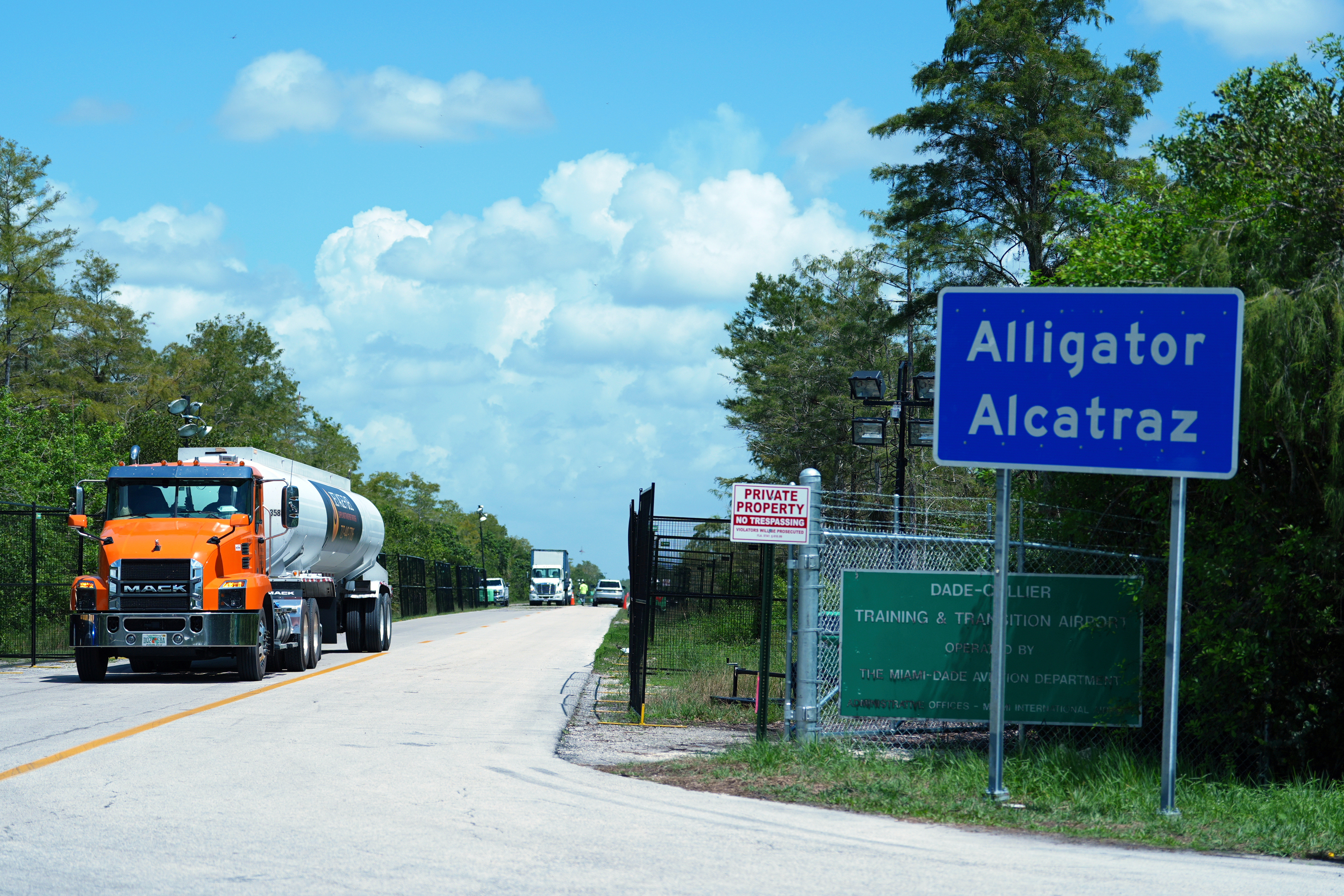 Trucks come and go from the "Alligator Alcatraz" immigration detention center in the Florida Everglades, Aug. 28, 2025, in Collier County, Fla. All detainees at "Alligator Alcatraz," have been transferred to other facilities for concerns related to the hurricane season.