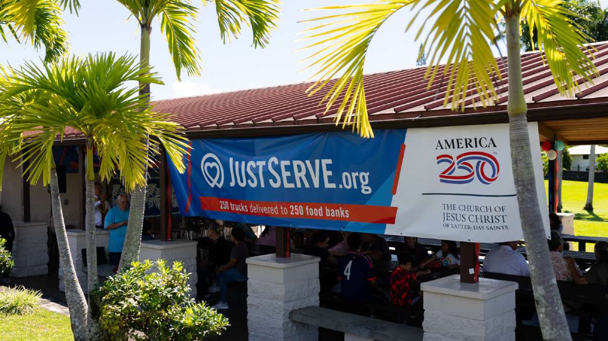 At a church parking lot in Hilo, Hawaii, on June 13, nonprofit representatives, members, and friends of The Church of Jesus Christ of Latter-day Saints meet to organize a food donation as part of the America 250 America Gives initiative.