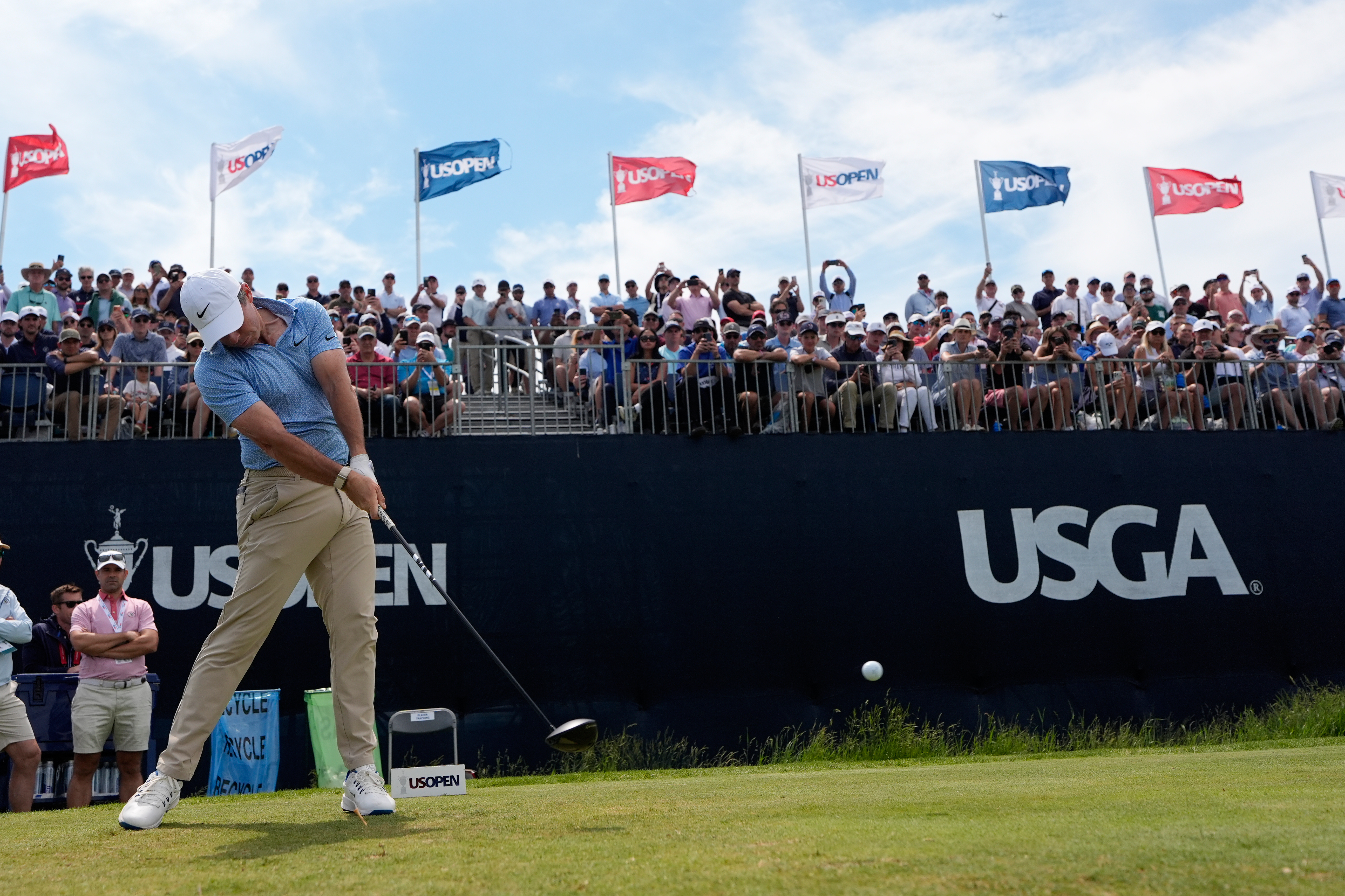 Rory McIlroy, of Northern Ireland, hits his tee shot on the 12th hole during a practice round for the U.S. Open golf tournament at Shinnecock Hills Golf Club in Southampton, N.Y., Wednesday, June 17, 2026.