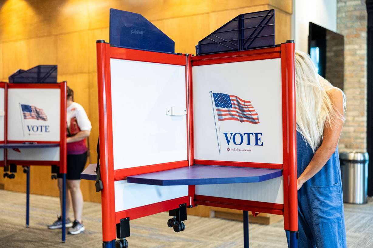 Voters fill out their ballots during primary election voting held at the Lehi Public Safety Building on June 25, 2024. Republicans are seeing their chance to influence the 1st Congressional District's Democratic primary.