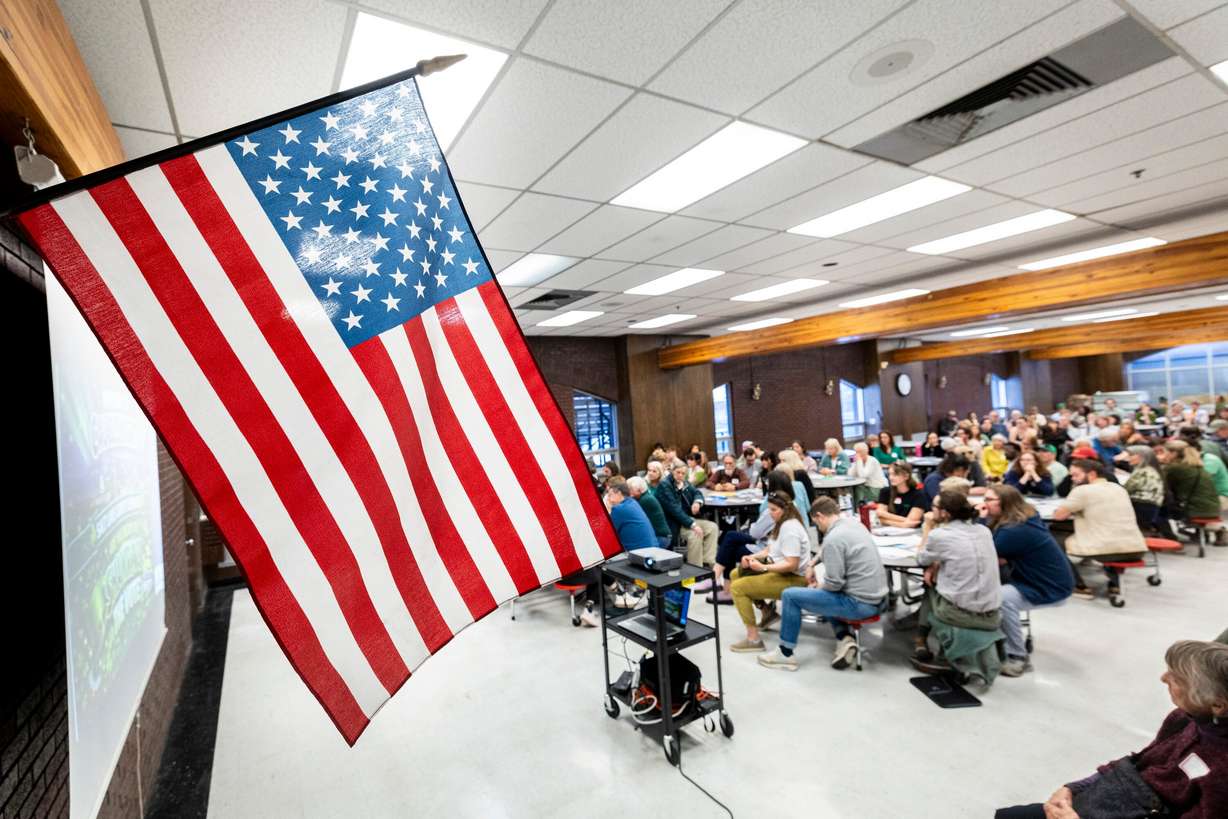 Constituents listen to a speaker during a gathering held by Democrats in House District 22 at West High School in Salt Lake City as part of caucus night in Utah on March 17. Republican influence in this year's Democratic primaries could be felt statewide.