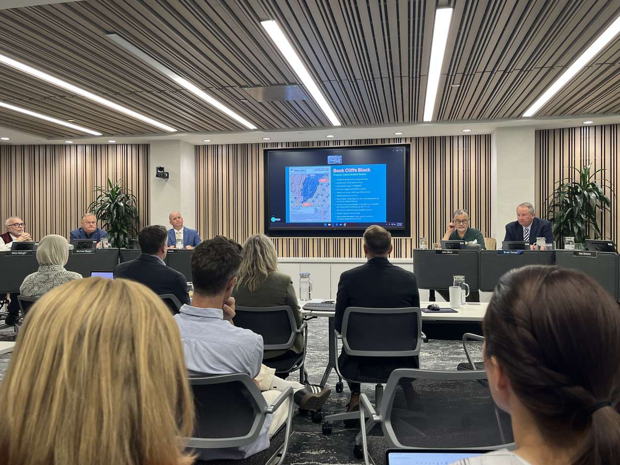 Members of the School and Institutional Trust Lands Administration board meet on Thursday. The board approved a sale of over 50,000 acres to the Utah Division of Wildlife Resources during the meeting.