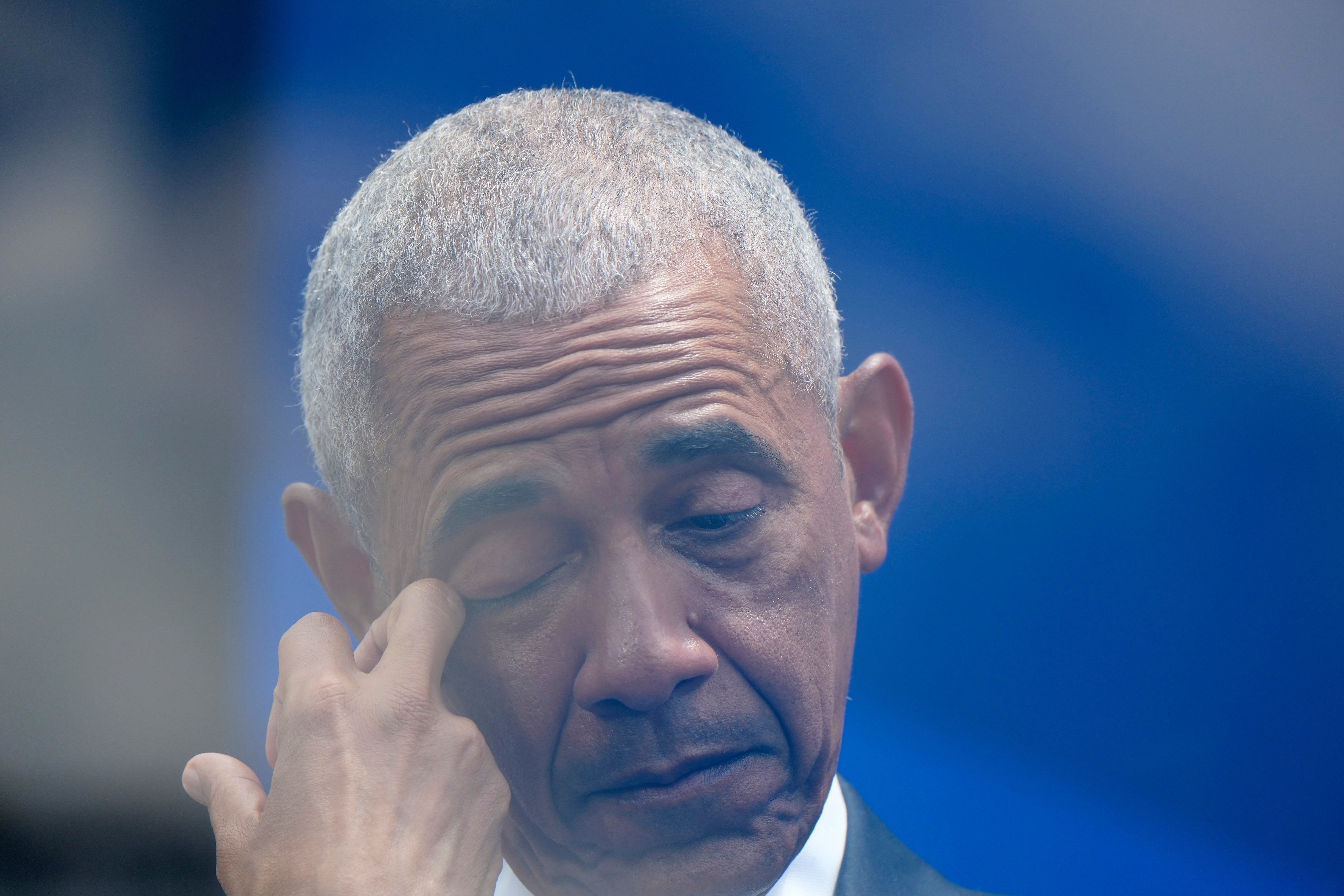 Former President Barack Obama reacts to remarks by former first lady Michelle Obama during the dedication ceremony for the Obama Presidential Center, Thursday, in Chicago. Michelle Obama spoke about her husband's resilience and accomplishments in office.