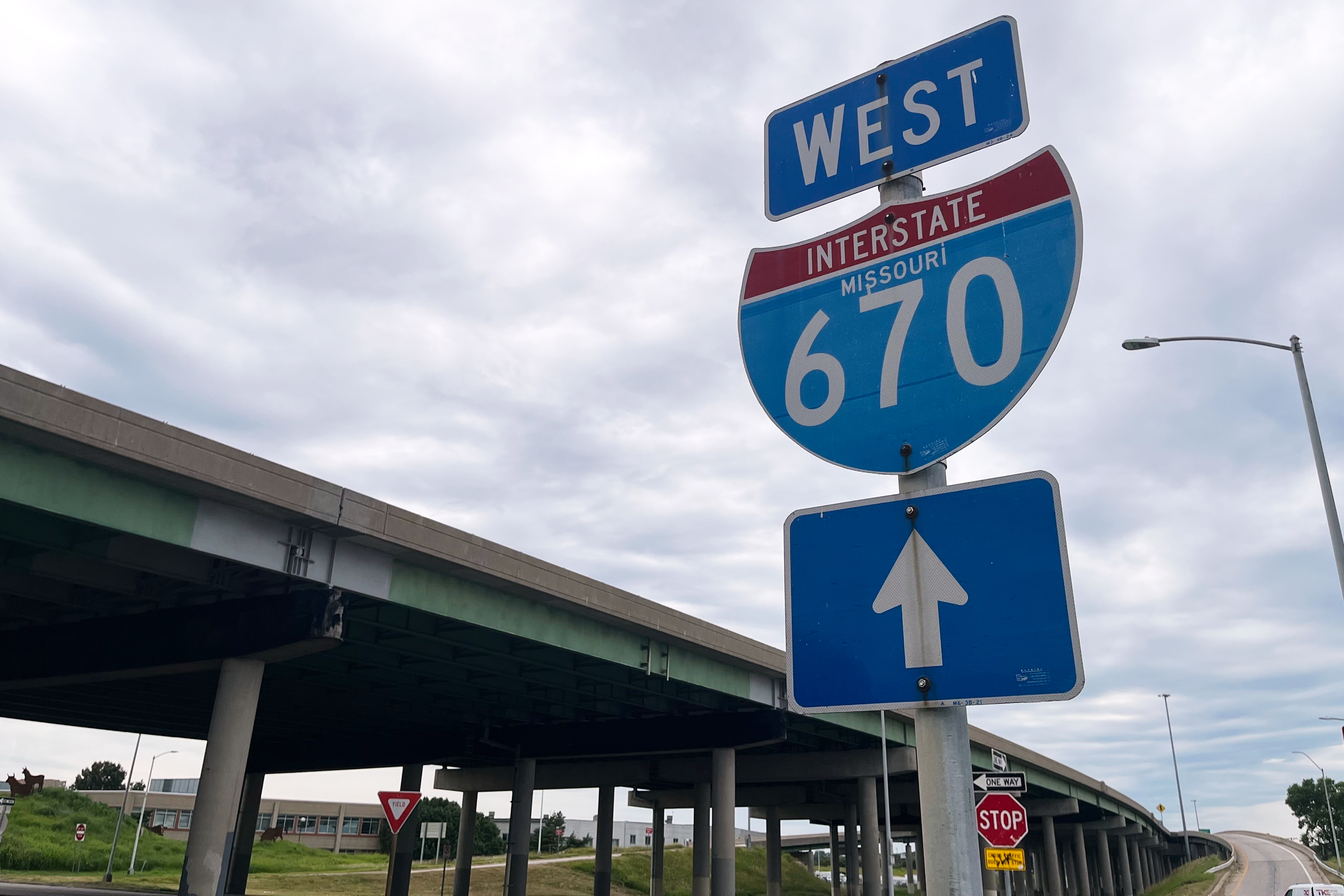 A sign for I-670 is seen near the site of a shooting Thursday, June 18, 2026, in Kansas City, Mo.