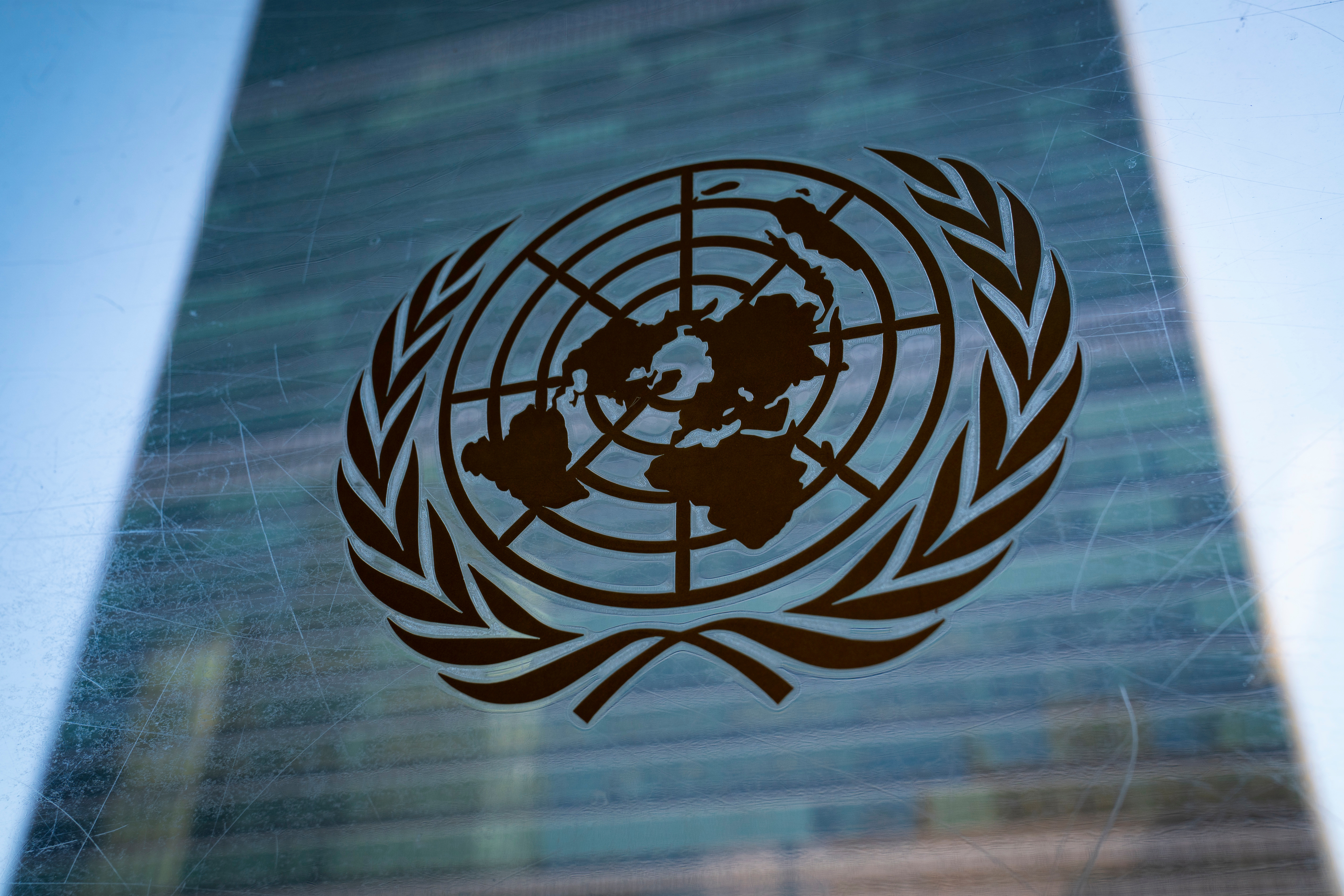 The symbol of the United Nations is displayed outside the Secretariat Building, Feb. 28, 2022, at United Nations Headquarters.