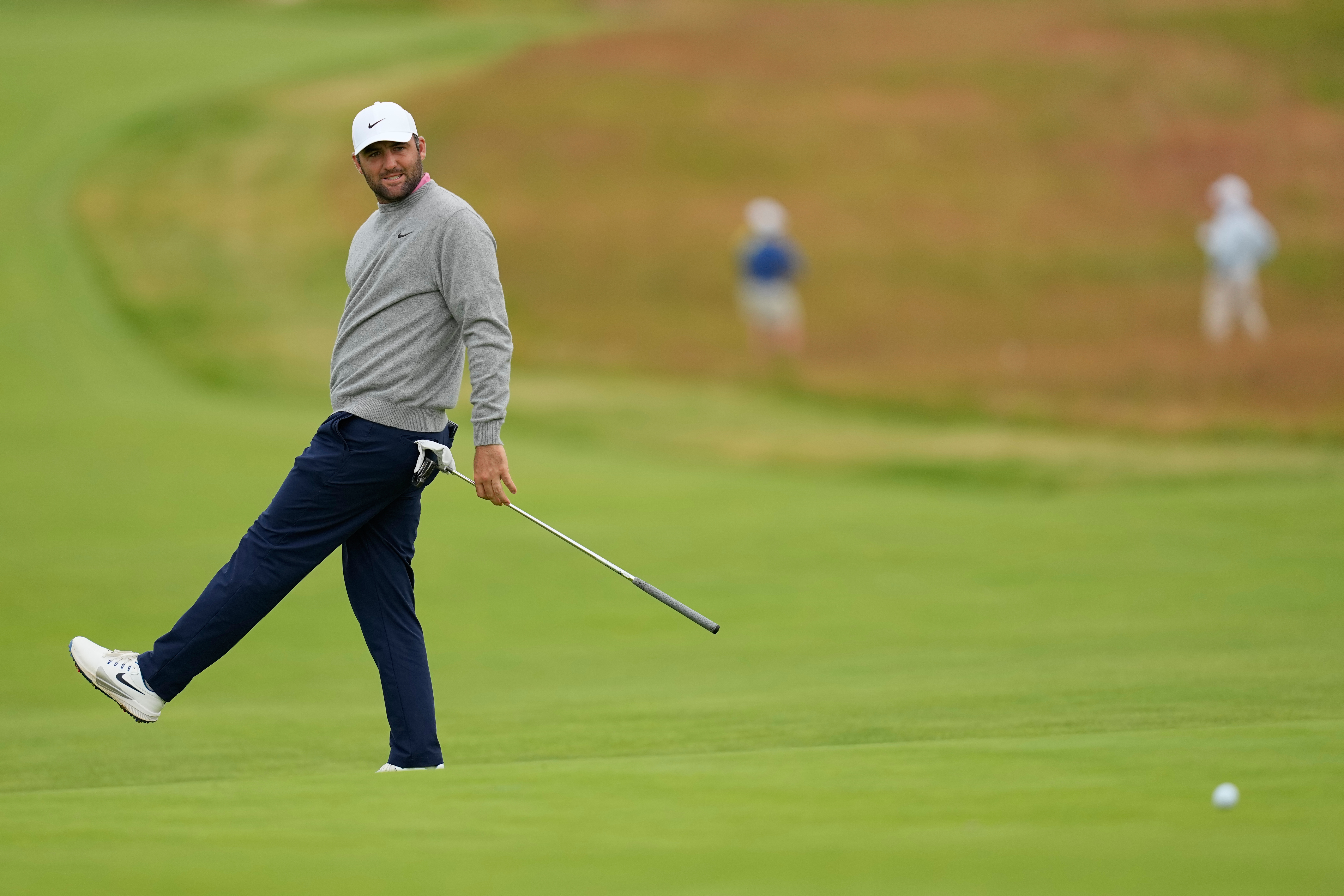 Scottie Scheffler reacts after missing a putt on the third hole during the first round of the U.S. Open golf tournament at Shinnecock Hills Golf Club in Southampton, N.Y., Thursday, June 18, 2026.