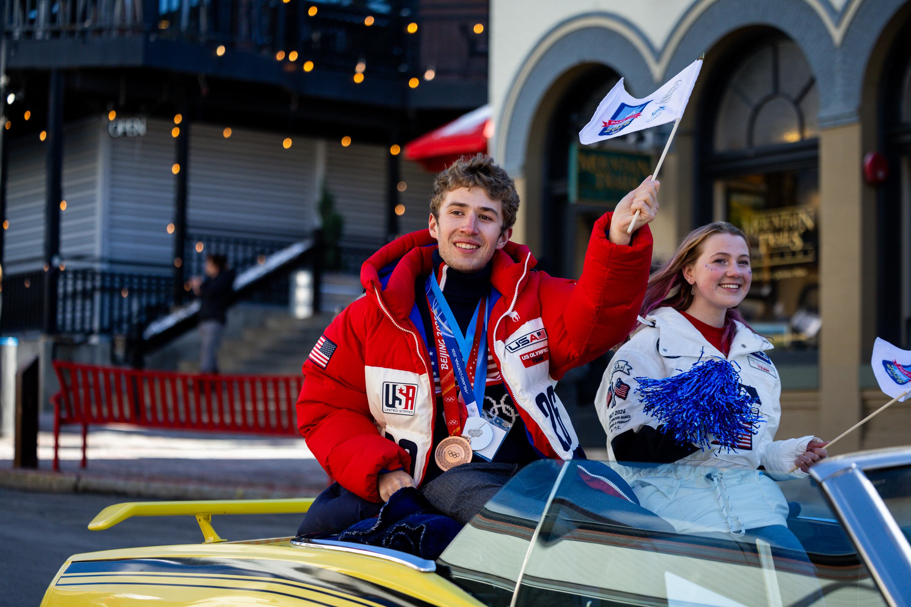 Casey Dawson, who competed in the Olympics in 2022 and 2026 in speedskating and won one silver and one bronze, respectively, left, and Josie Johnson, who competed in the Olympics in 2026 in ski jumping, right, participate with fellow Olympians and Paralympians from across Utah, including athletes returning from the 2026 Winter Games, during a Youth Sports Alliance Olympic and Paralympic Homecoming Parade on Main Street in Park City on April 3.