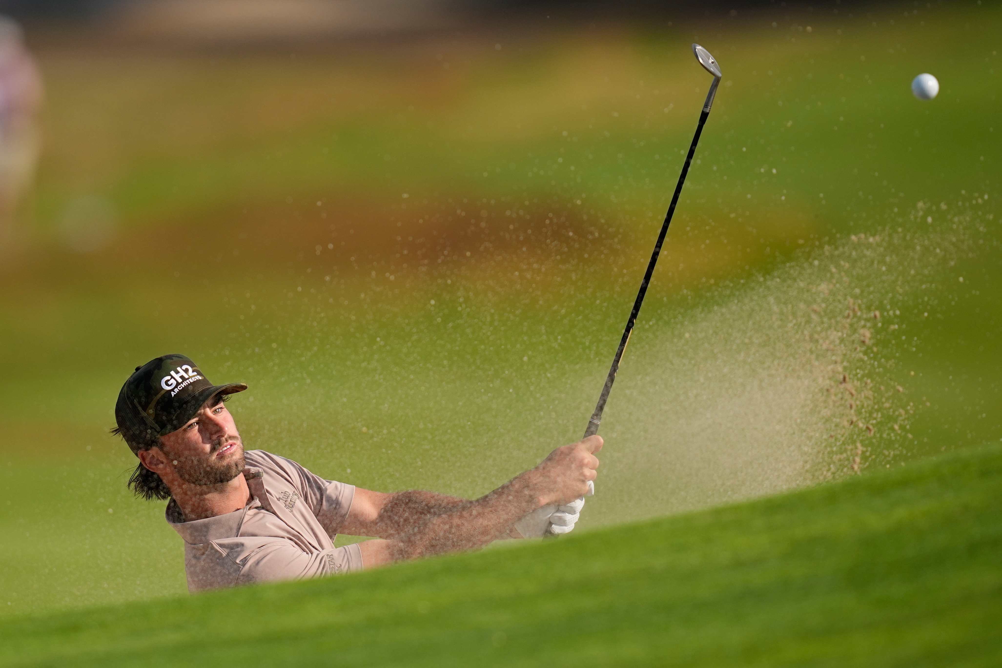 Ryder Cowan hits from the bunker on the second hole during the first round of the U.S. Open golf tournament at Shinnecock Hills Golf Club in Southampton, N.Y., Thursday, June 18, 2026.