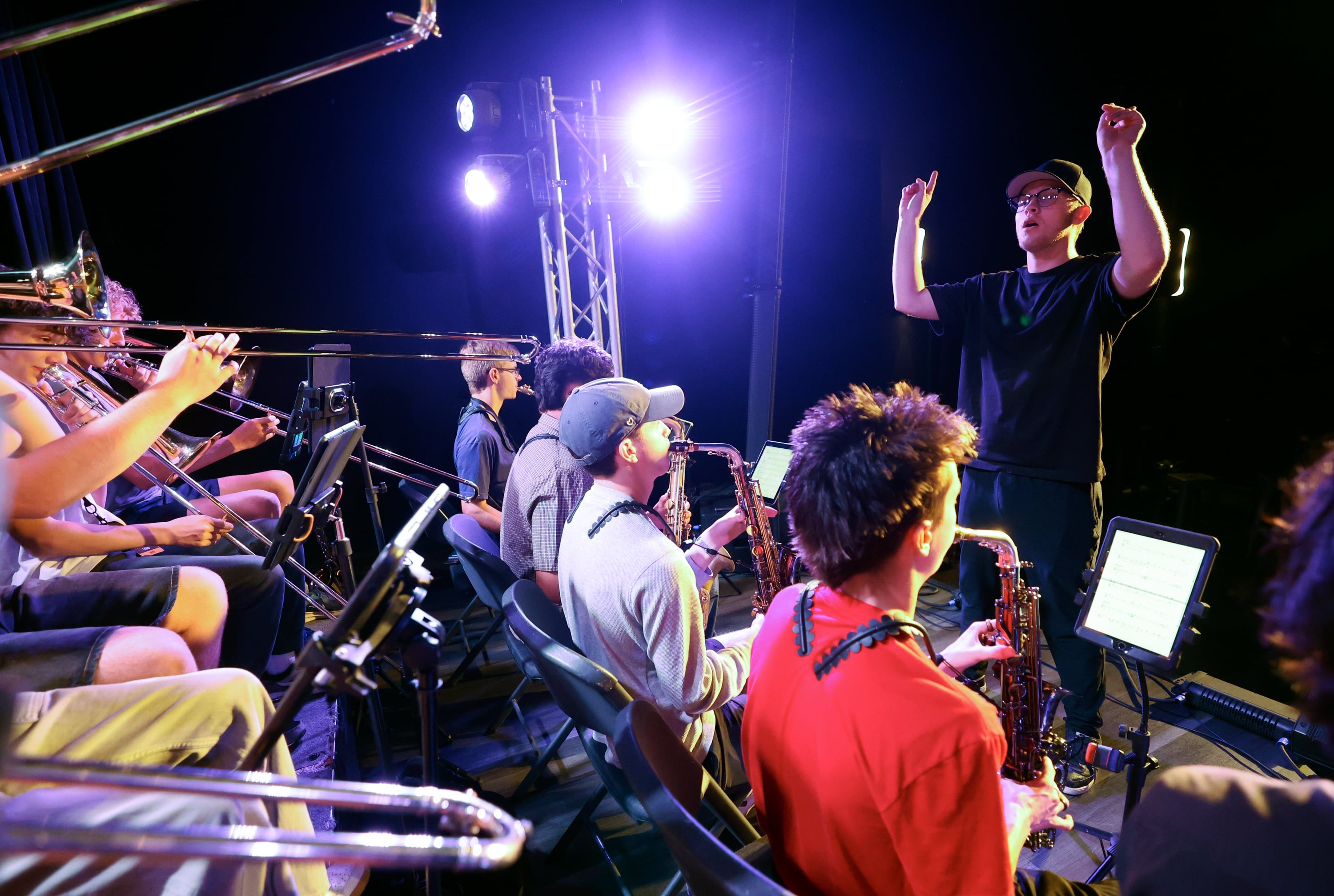 Kadem Larm conducts a Crescent Super Band rehearsal at Caleb Chapman’s Soundhouse in Pleasant Grove on June 15.