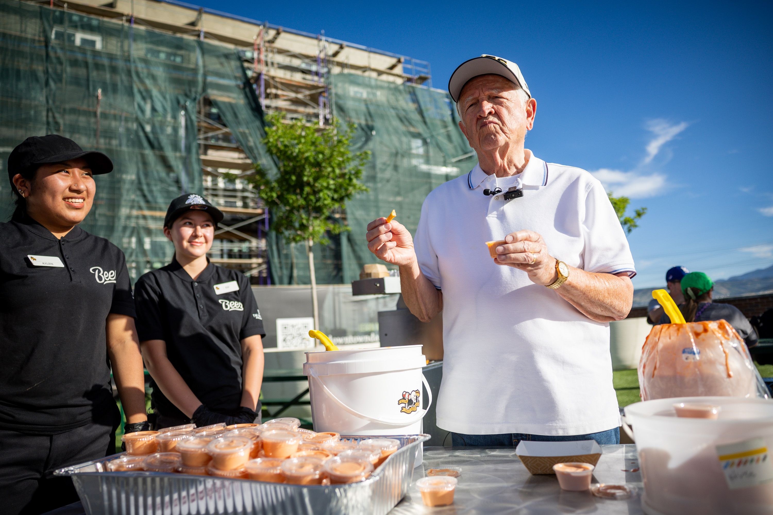 Ron Taylor, the first person to mix fry sauce at the Provo Arctic Circle when he was a teen in the 1950s, samples different fry sauces from Utah businesses at Fry Sauce Night during a Salt Lake Bees game against the Tacoma Rainiers at The Ballpark at America First Square in South Jordan on Thursday.