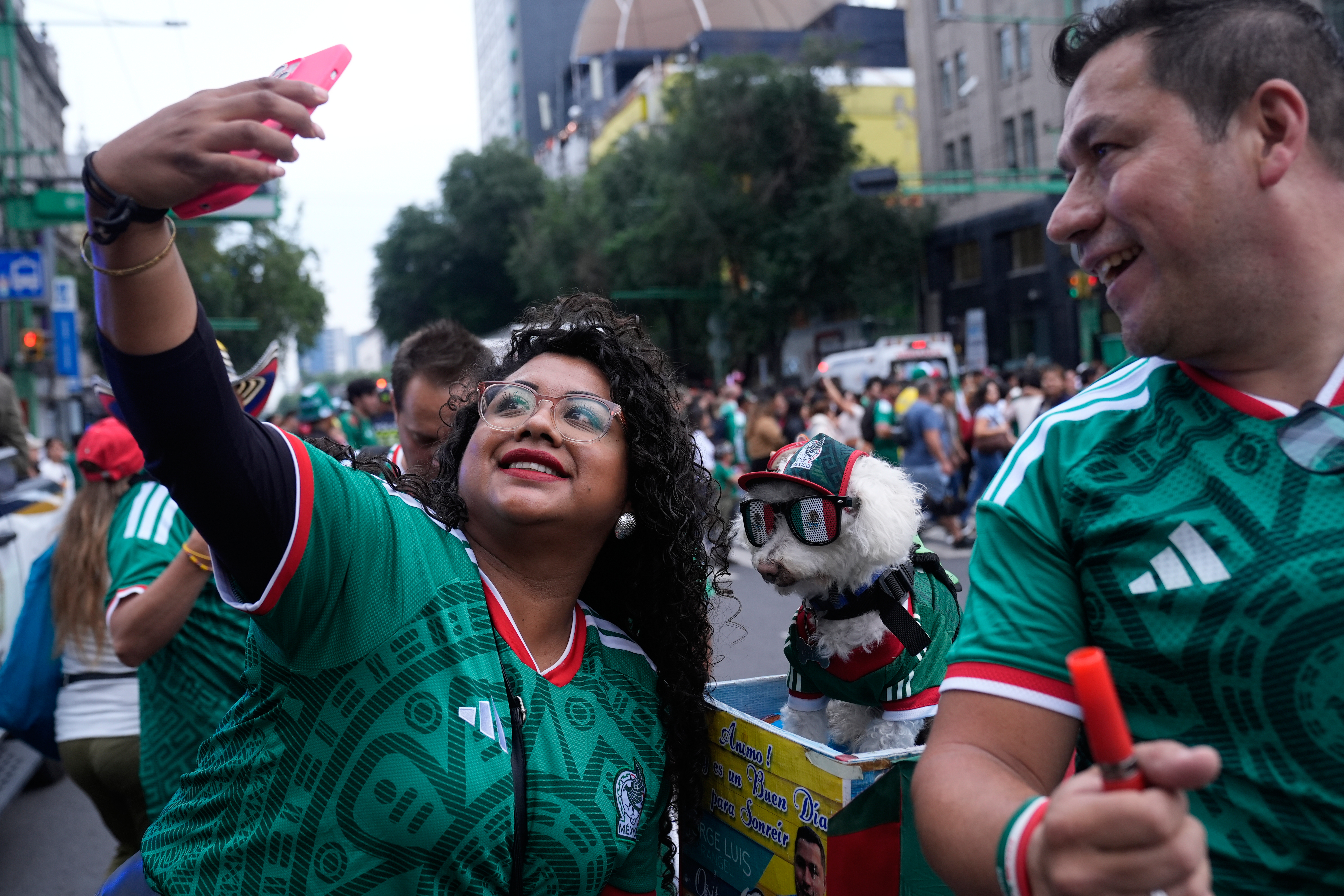 Rescue dog Osito steals hearts at the World Cup, one bike ride at a time
