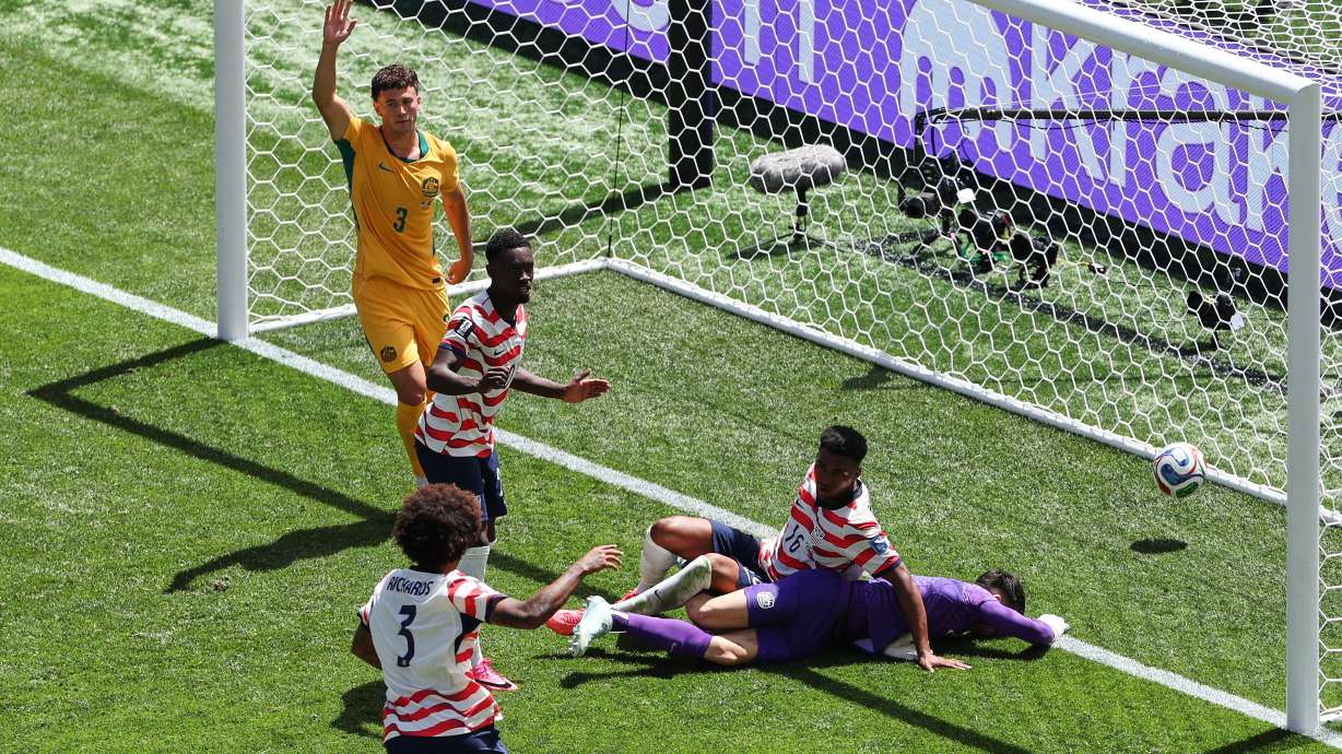 Australia's Aiden O'Neill (13) appeals for offside after United States' Alex Freeman (16) scored a goal past Australia goalkeeper Patrick Beach (18) during the World Cup Group D soccer match between the United States and Australia in Seattle, Friday, June 19, 2026.