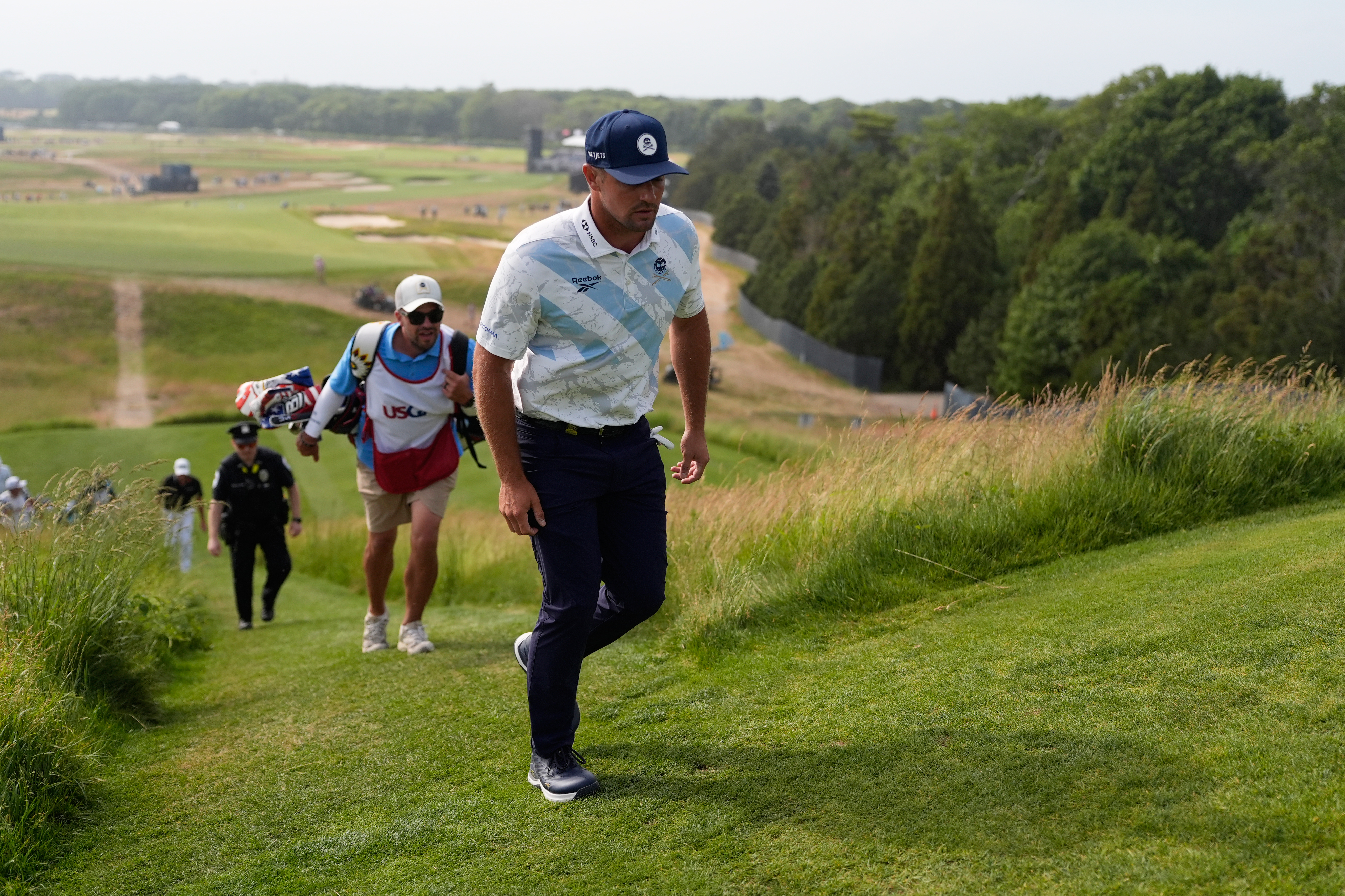 Bryson DeChambeau walks to the tee on the 15th hole during the first round of the U.S. Open golf tournament at Shinnecock Hills Golf Club in Southampton, N.Y., Thursday, June 18, 2026.